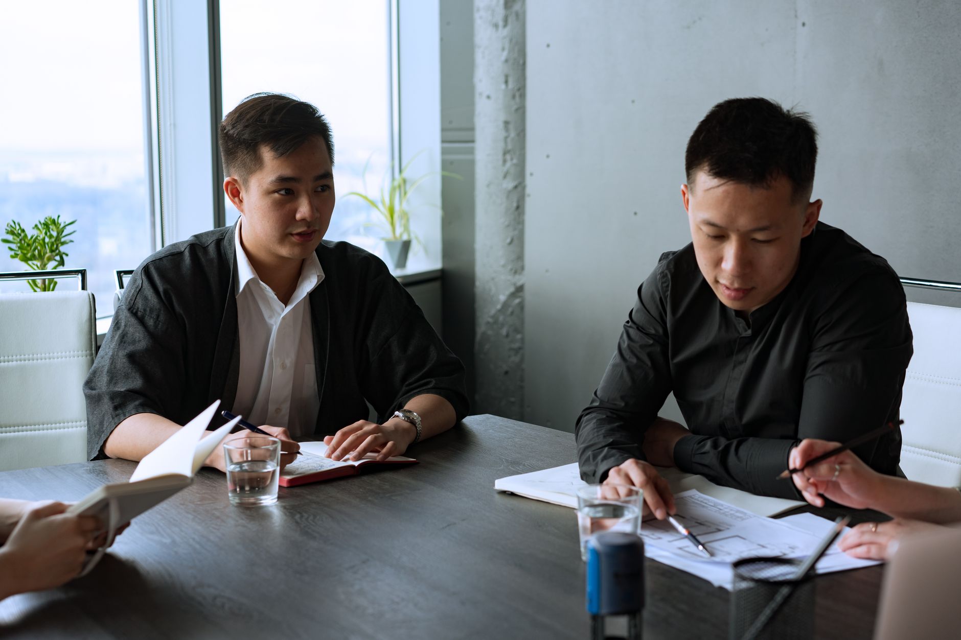 Professional team discussing housing strategy in meeting room