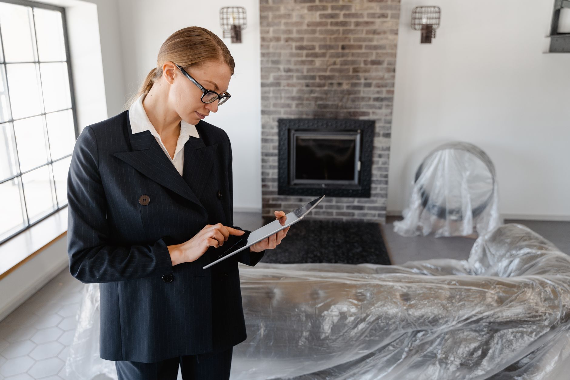  A housing officer using a digital tablet to review property listings