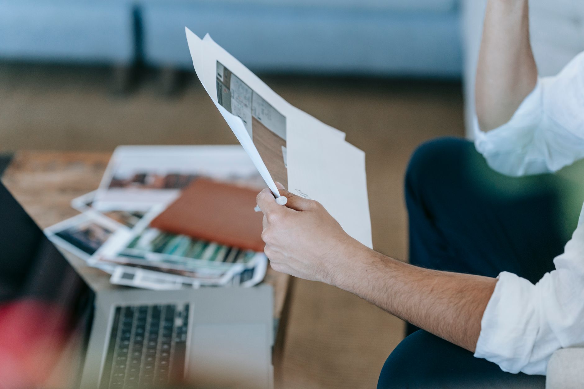 Landlord reviewing rental property documents laptop