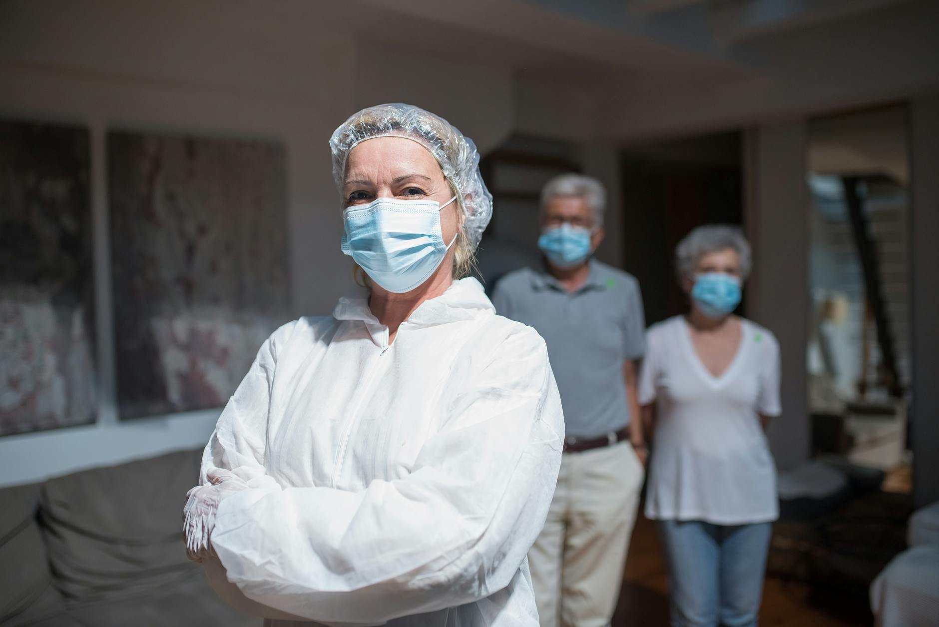 Healthcare worker visiting elderly tenant - alt text: NHS staff conducting home visit in social housing