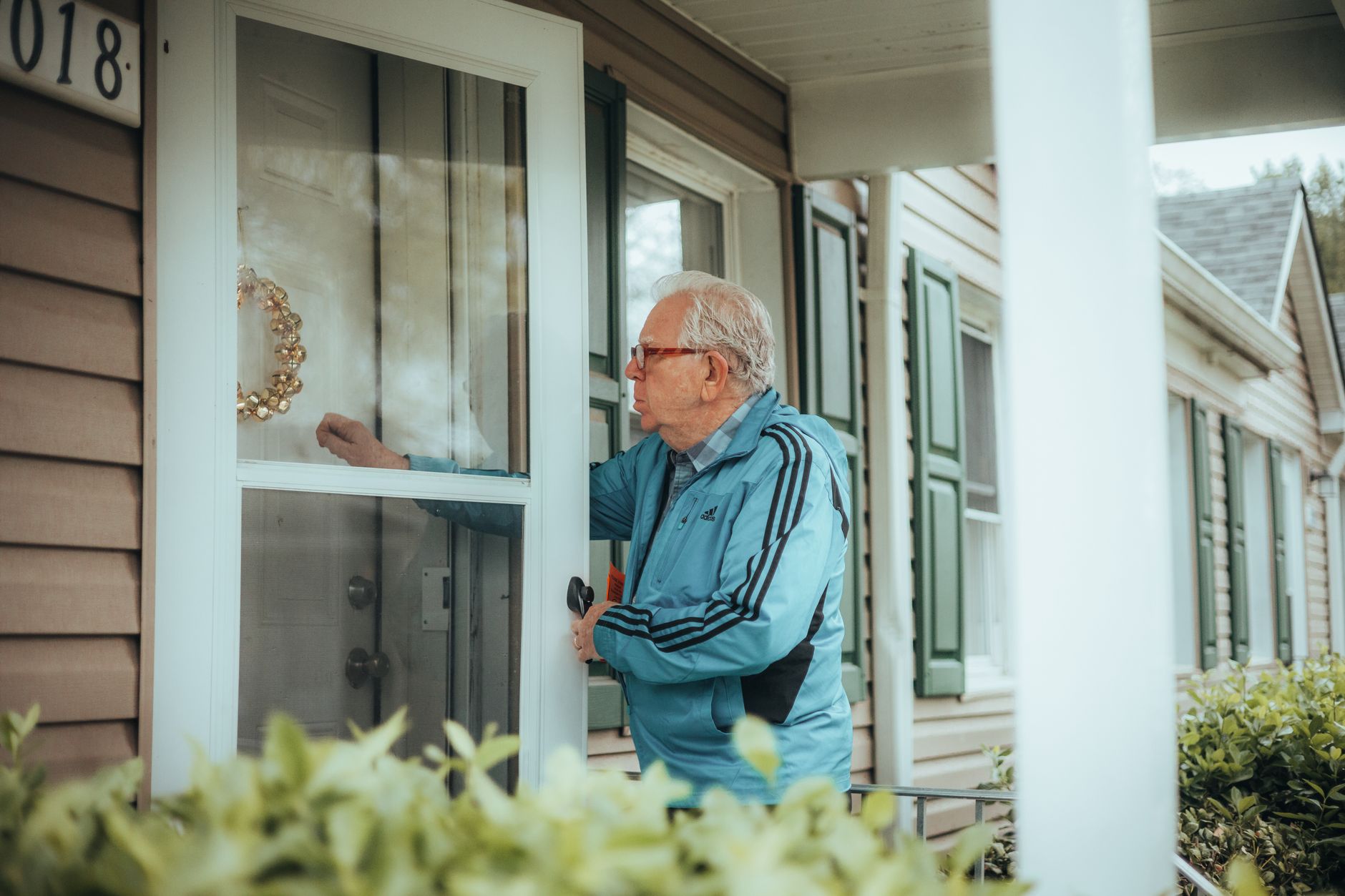 Healthcare professional visiting resident in adapted social housing
