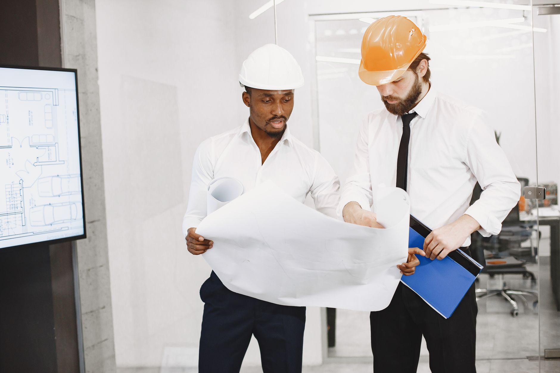 Architect reviewing cooling solutions for social housing development