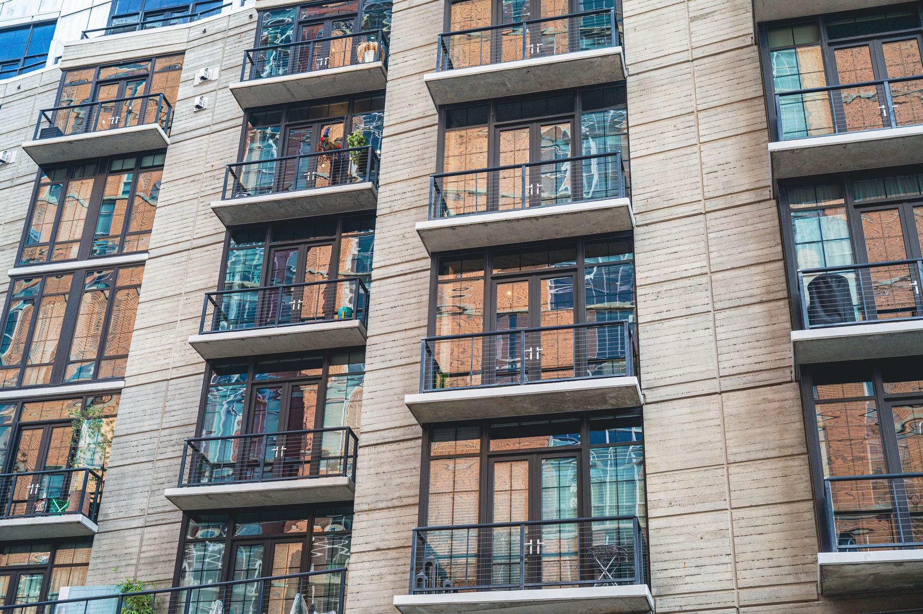 Modern social housing block with large windows and balconies