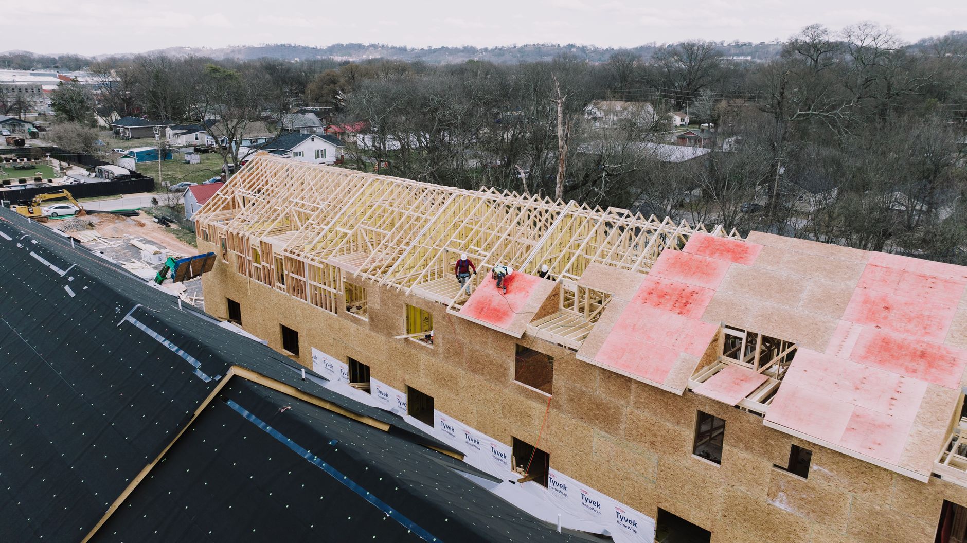 Construction workers building affordable housing units