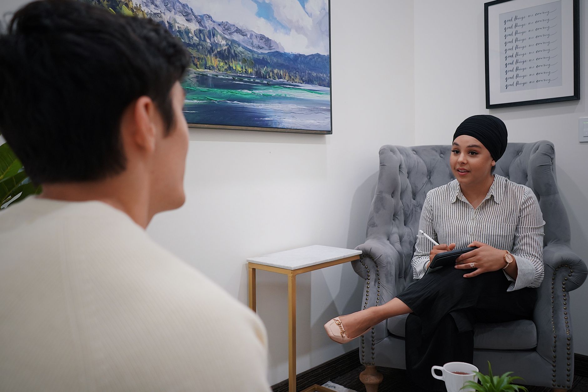 Support worker having one-to-one conversation with resident