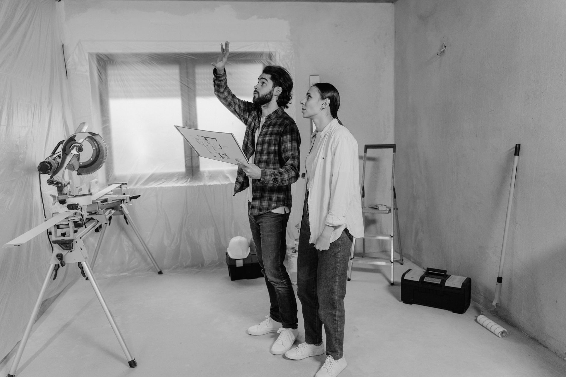 Landlord discussing energy upgrades with contractor