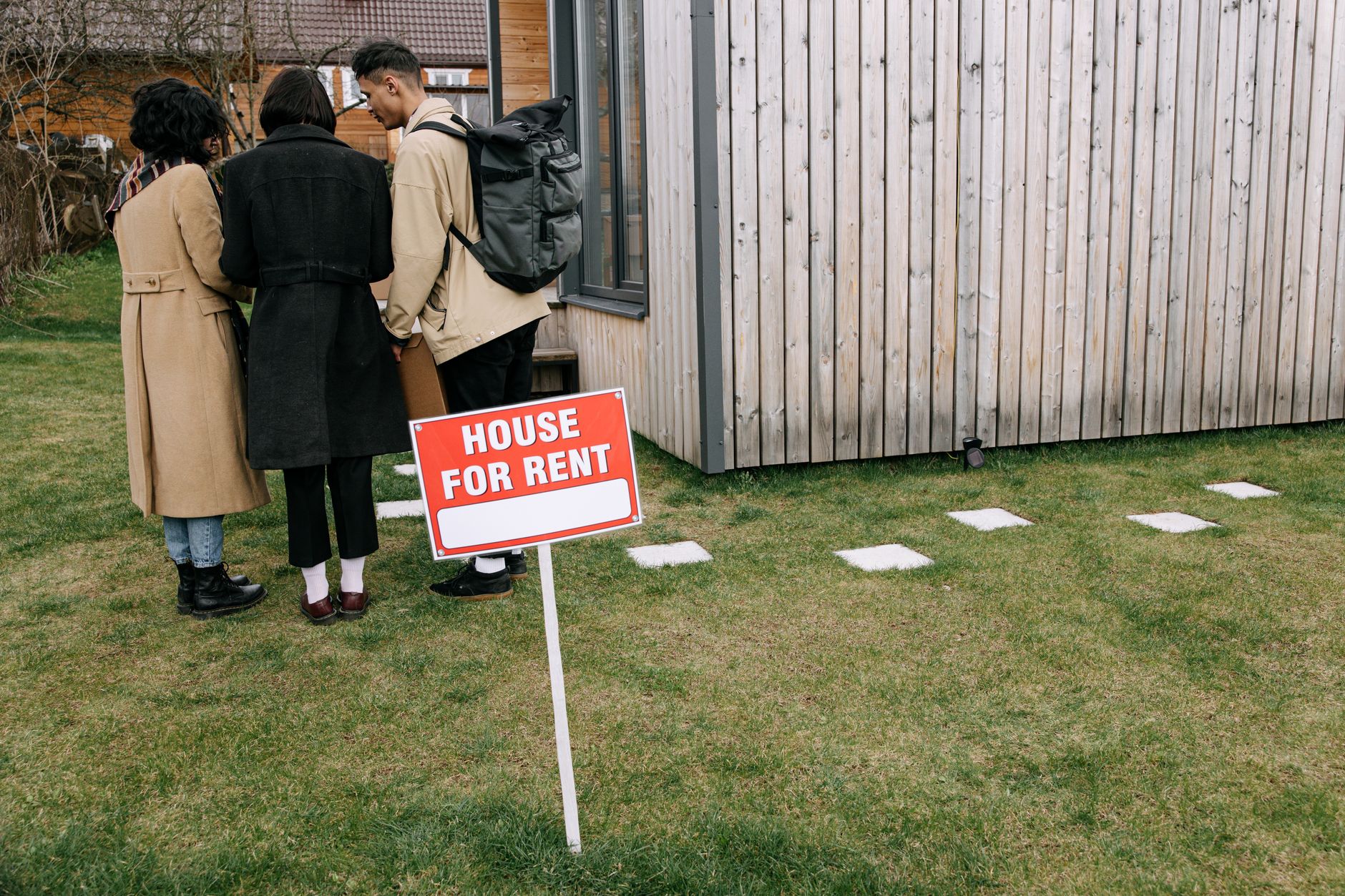 Family looking at rental property with housing officer