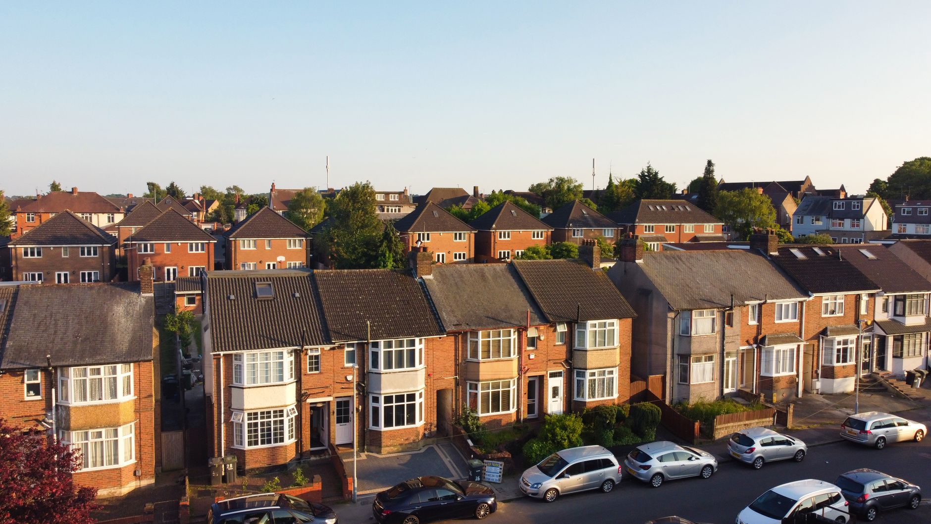 UK social housing estate with diverse residents - representing the potential impact of policy changes