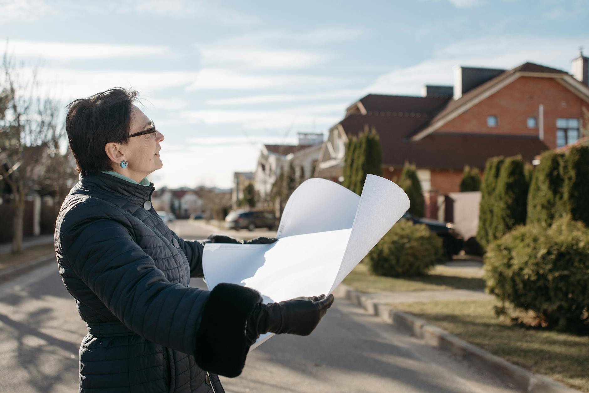 Architect reviewing plans for supported housing development