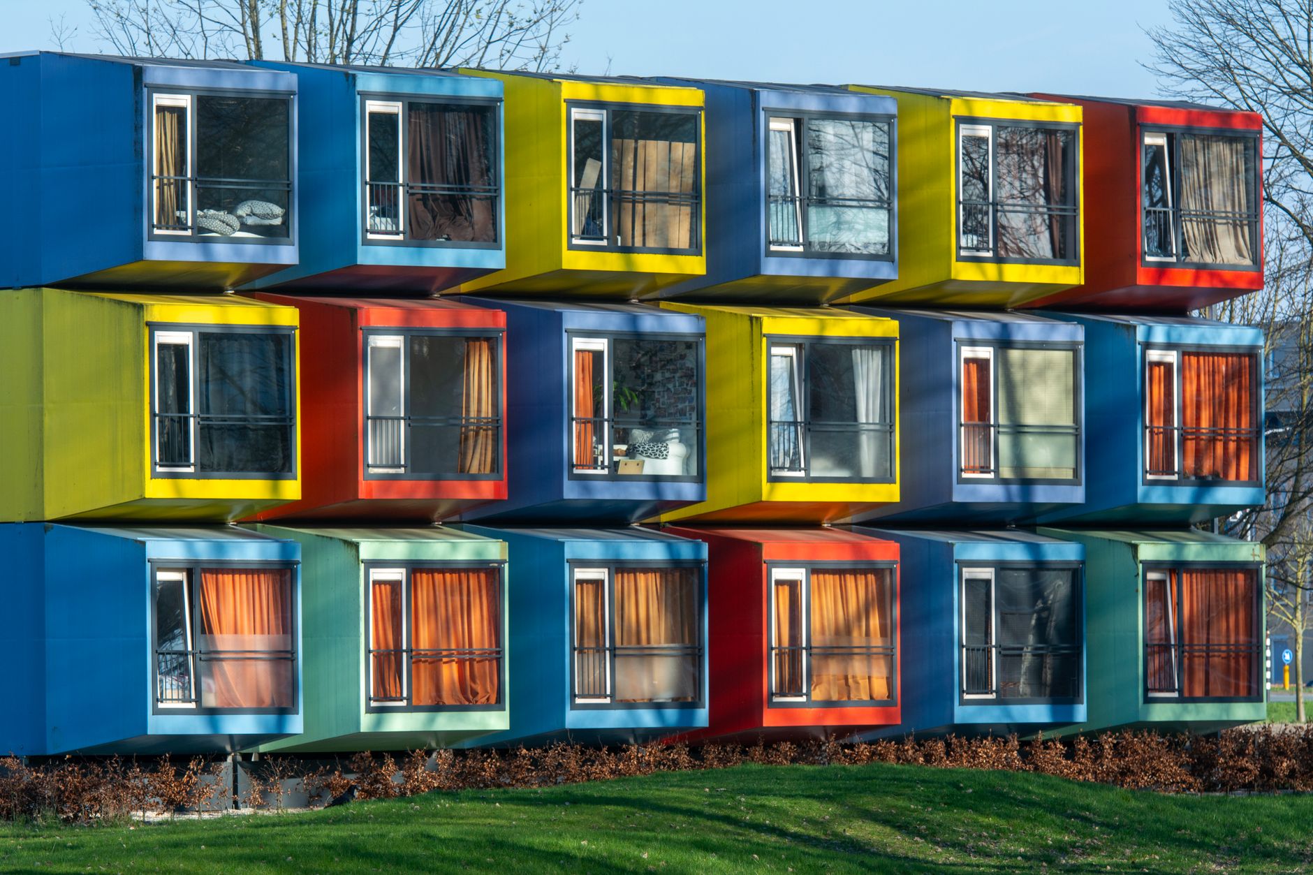 Construction workers assembling modular housing units