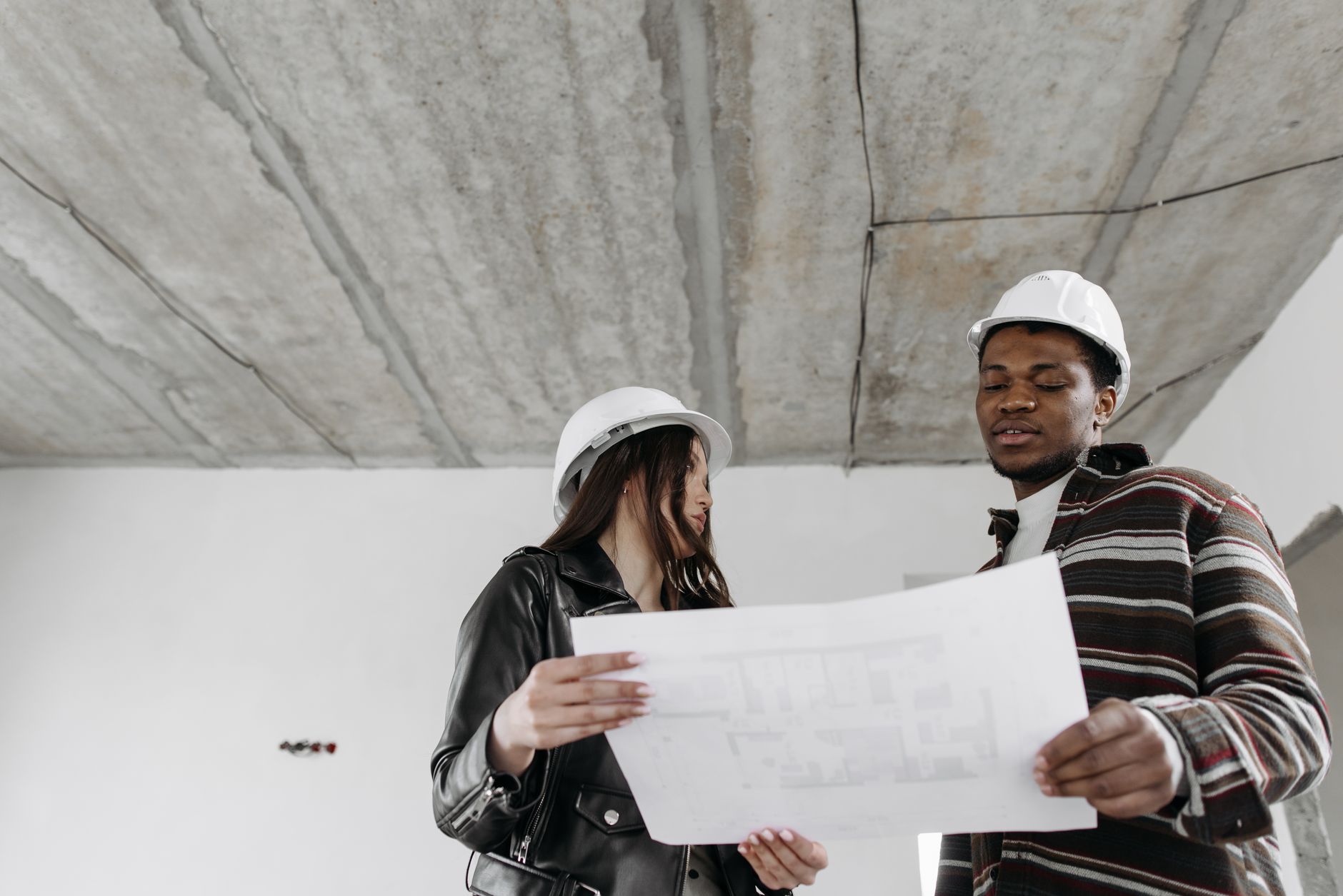 Construction team inspecting social housing build