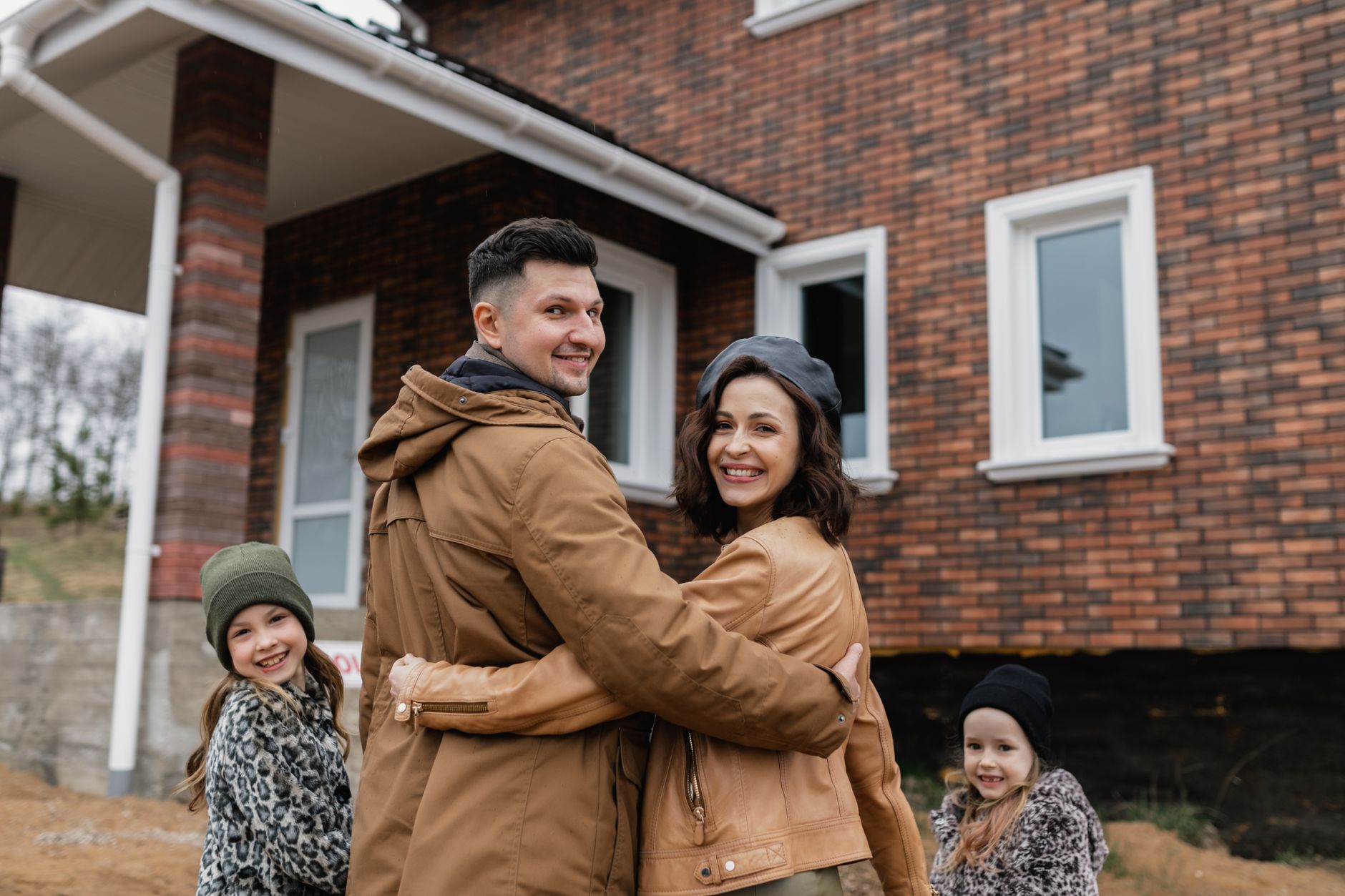 Smiling residents in front of new social housing