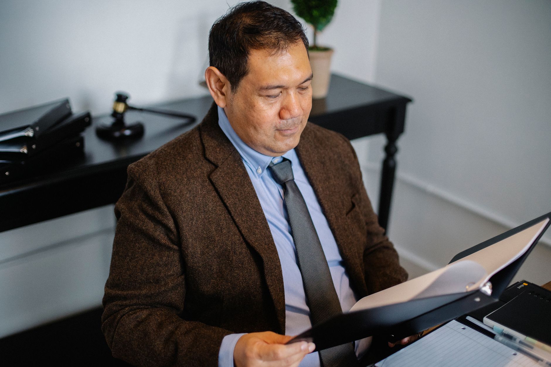 Professional reviewing housing complaint documents