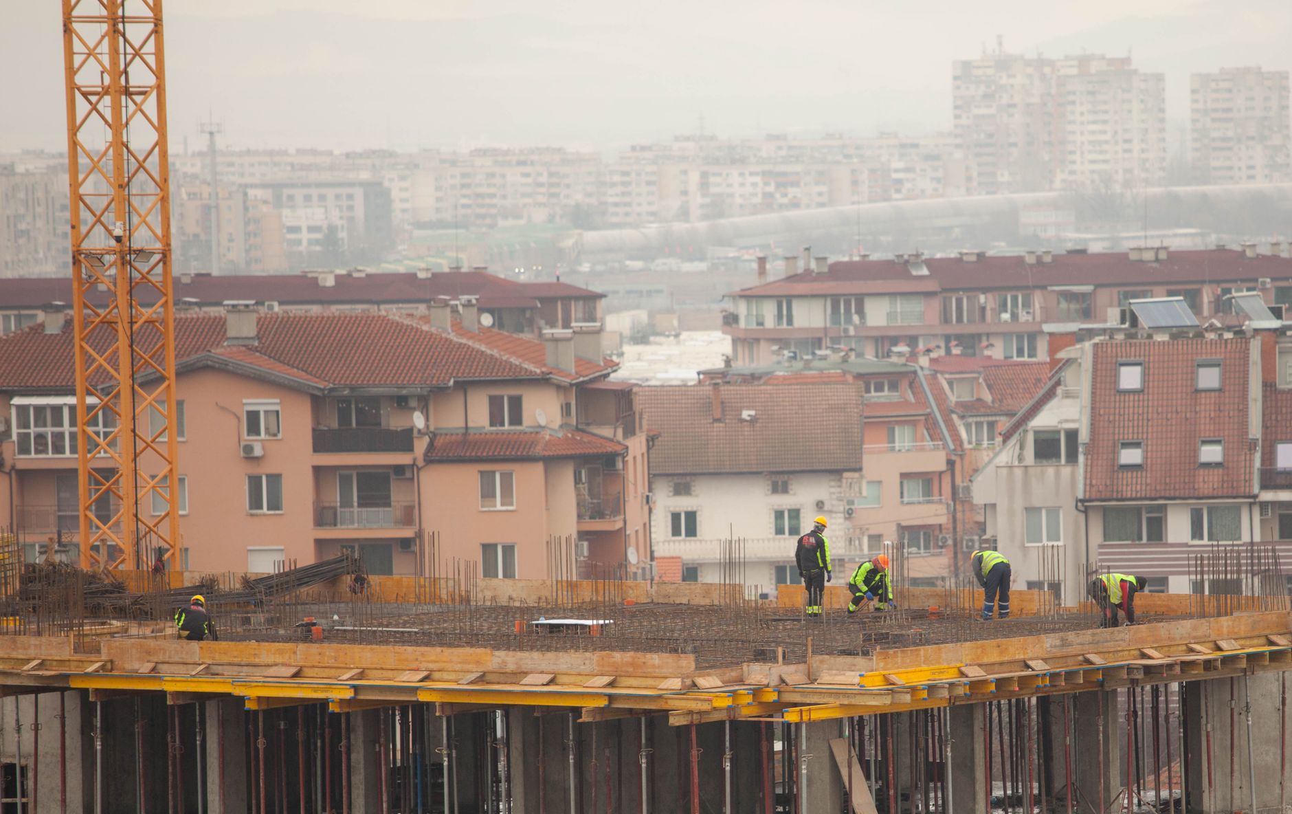 Construction workers building social housing - represents need for accelerated development