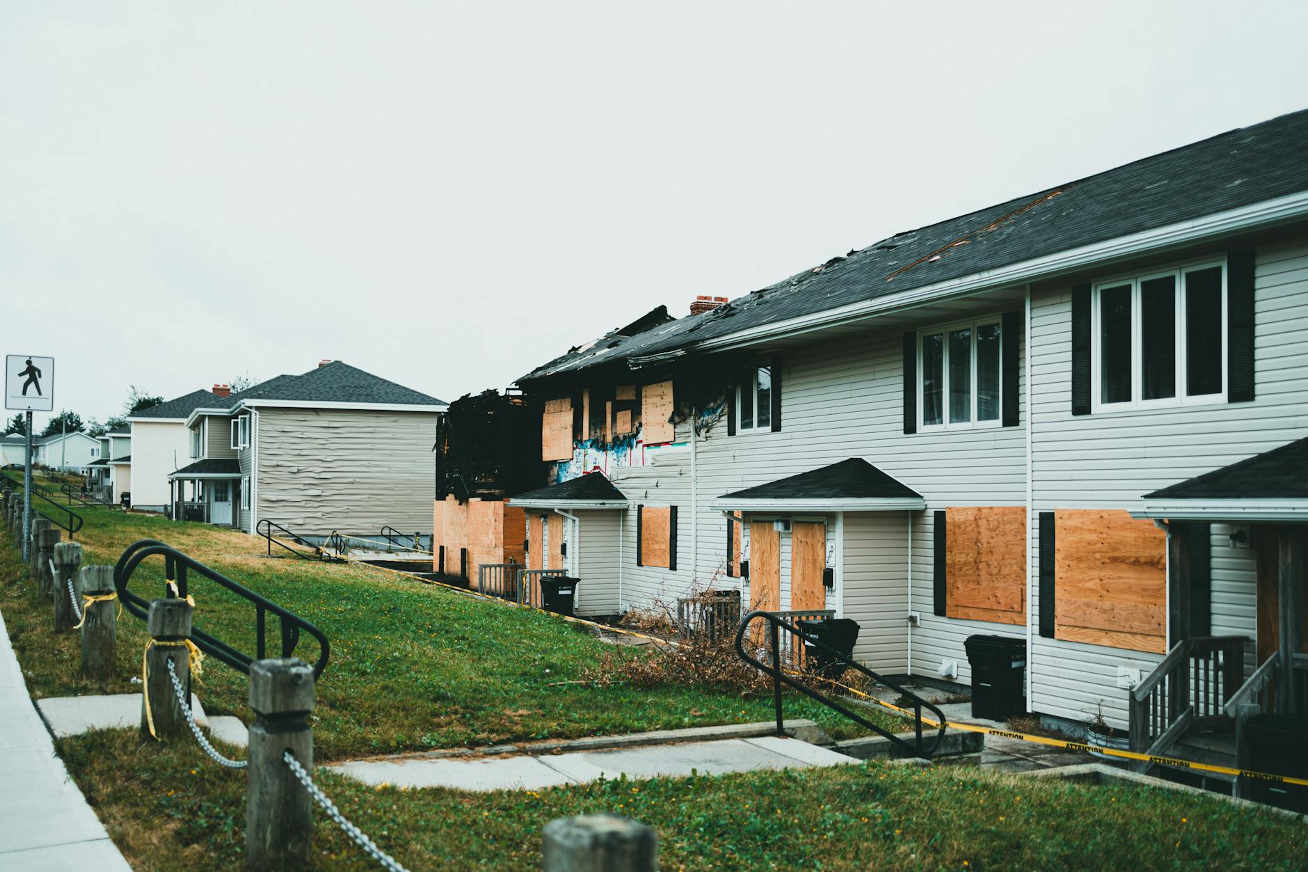 Abandoned property with boarded-up windows