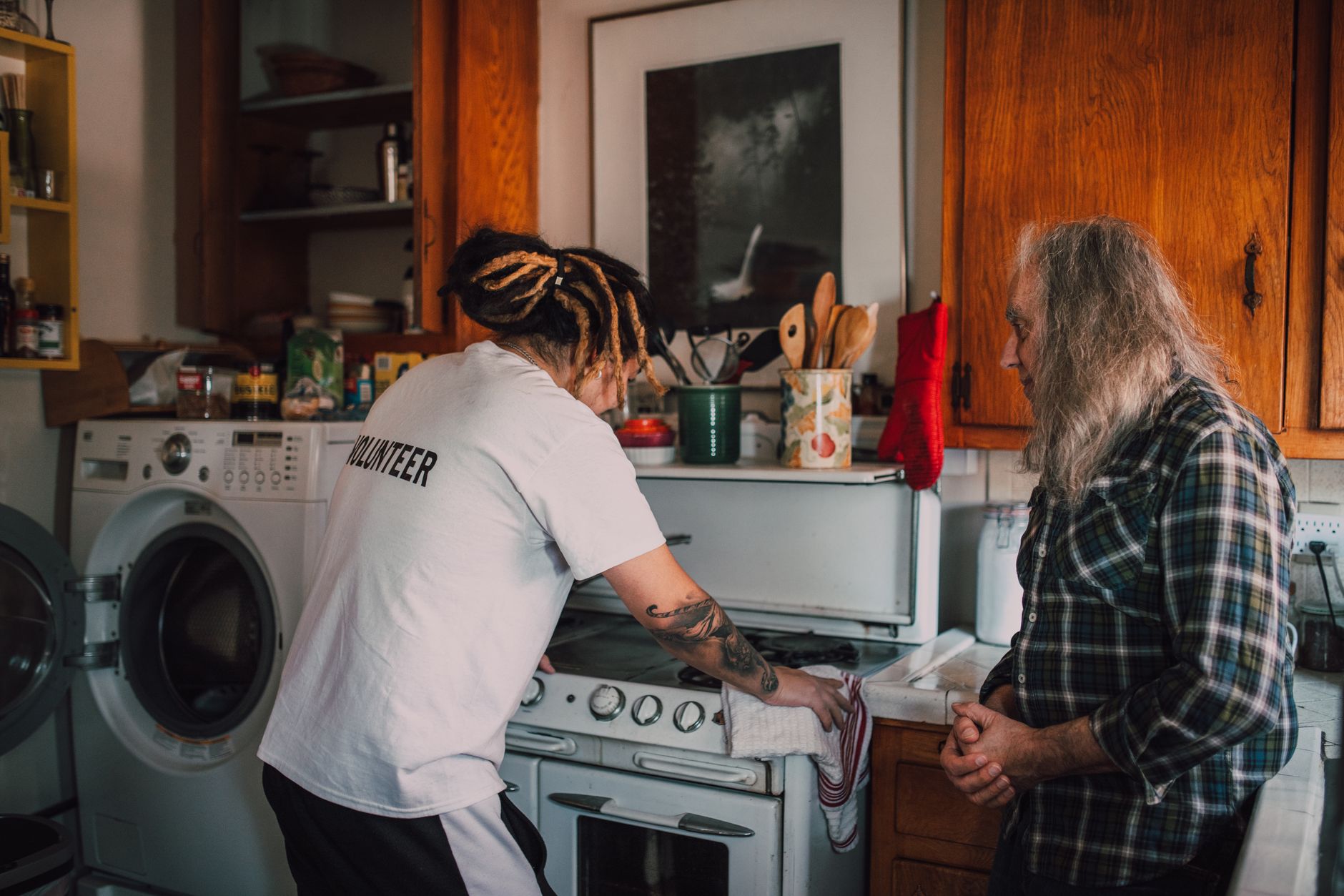 Support worker assisting tenant with household tasks