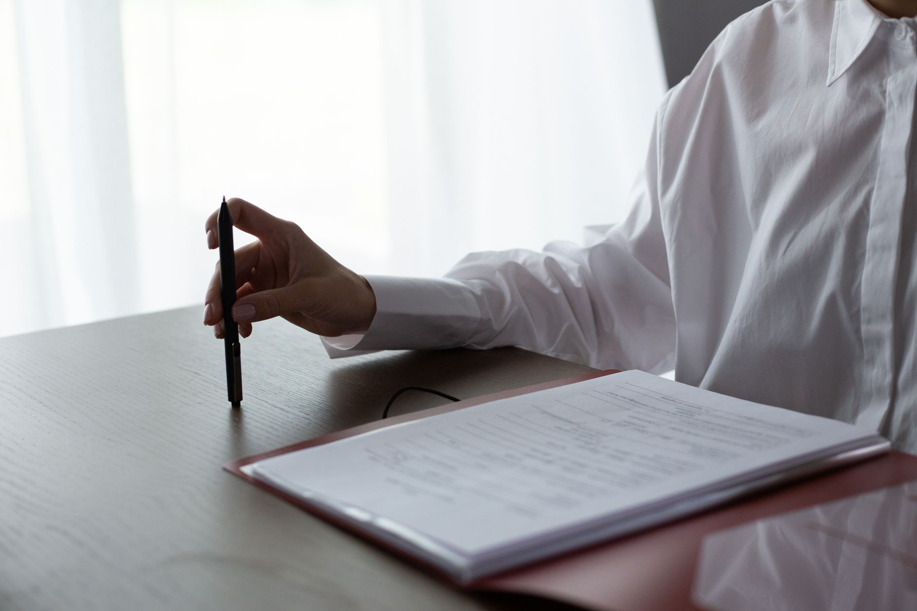 Landlord reviewing property documents at desk