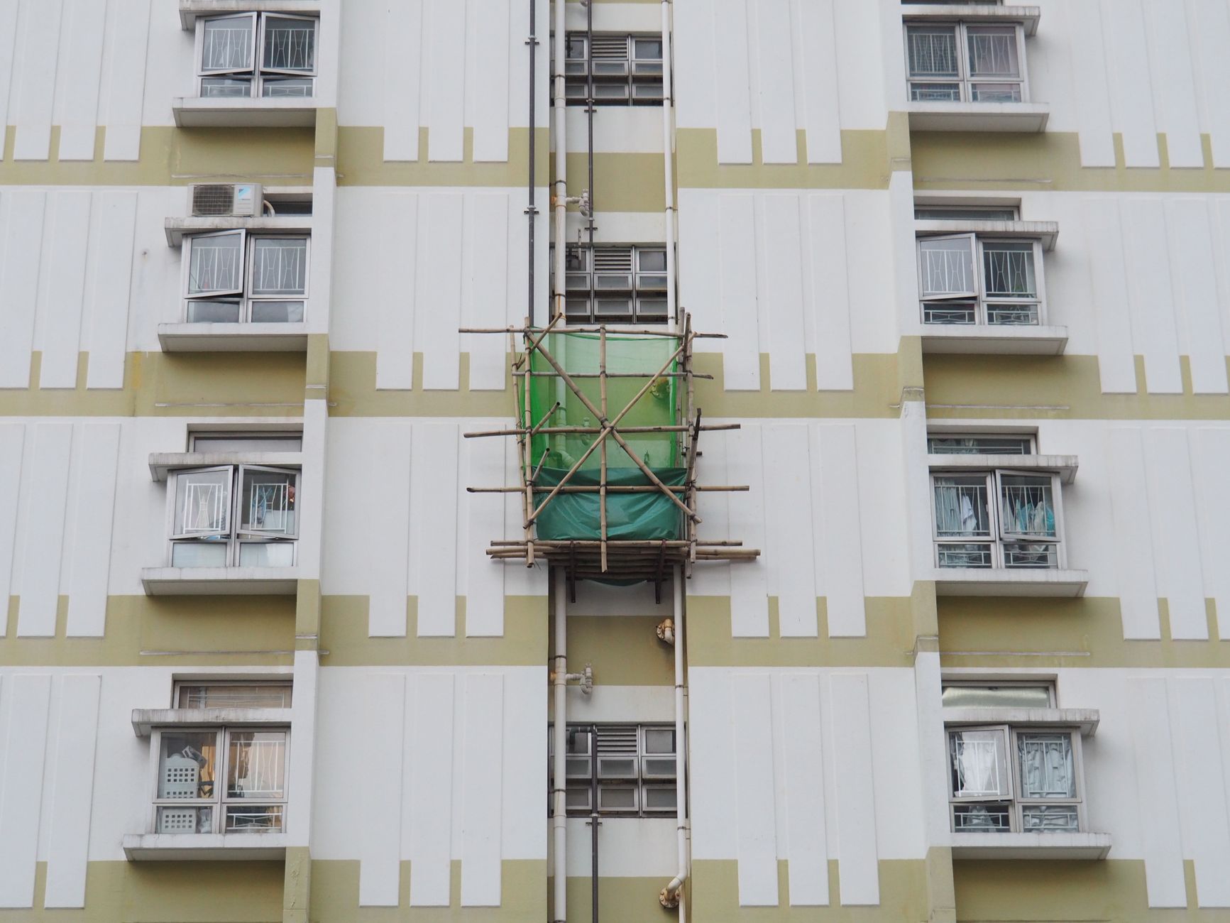 High-rise social housing block with scaffolding for remediation work