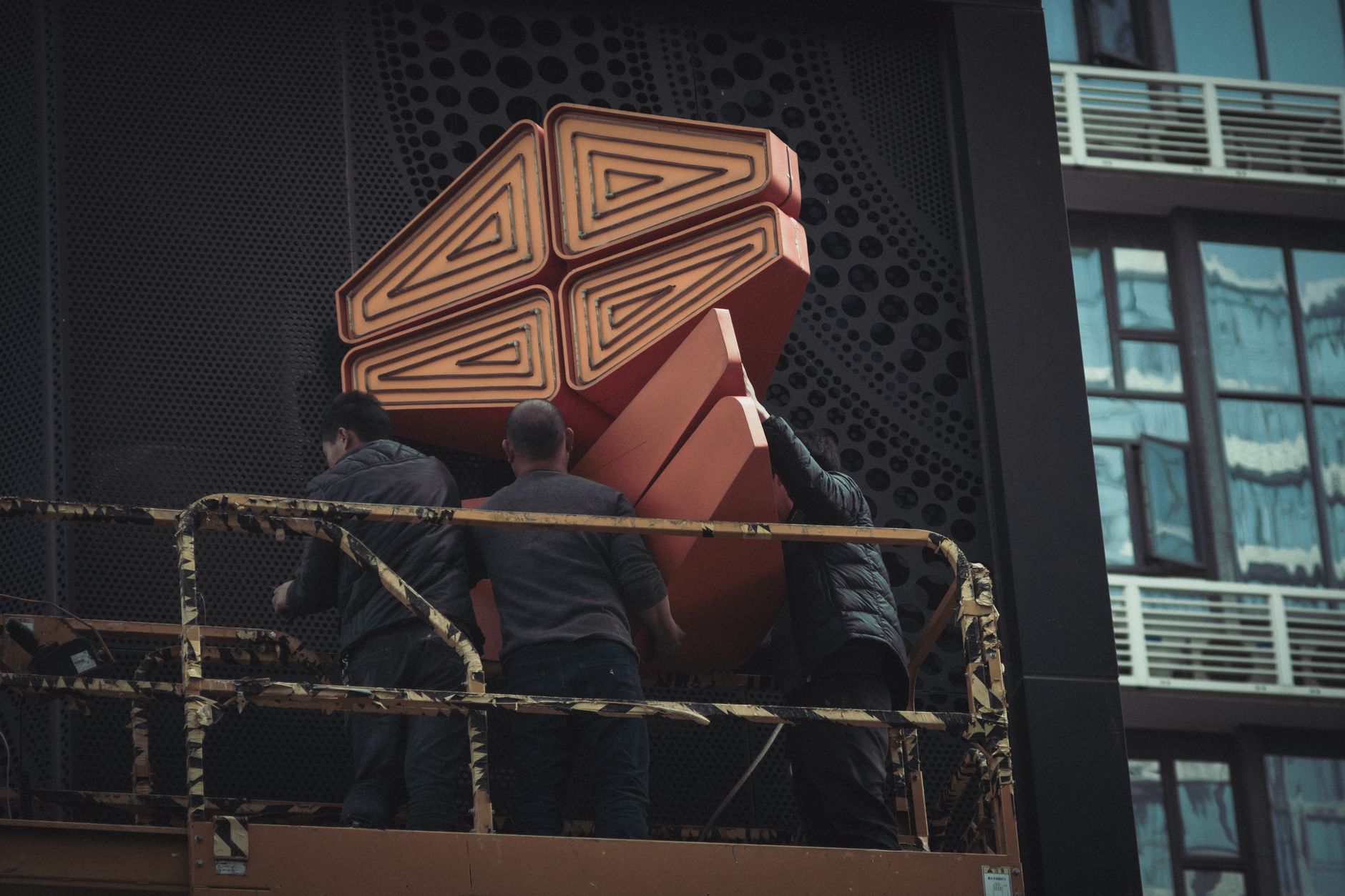 Construction workers assembling modular housing units