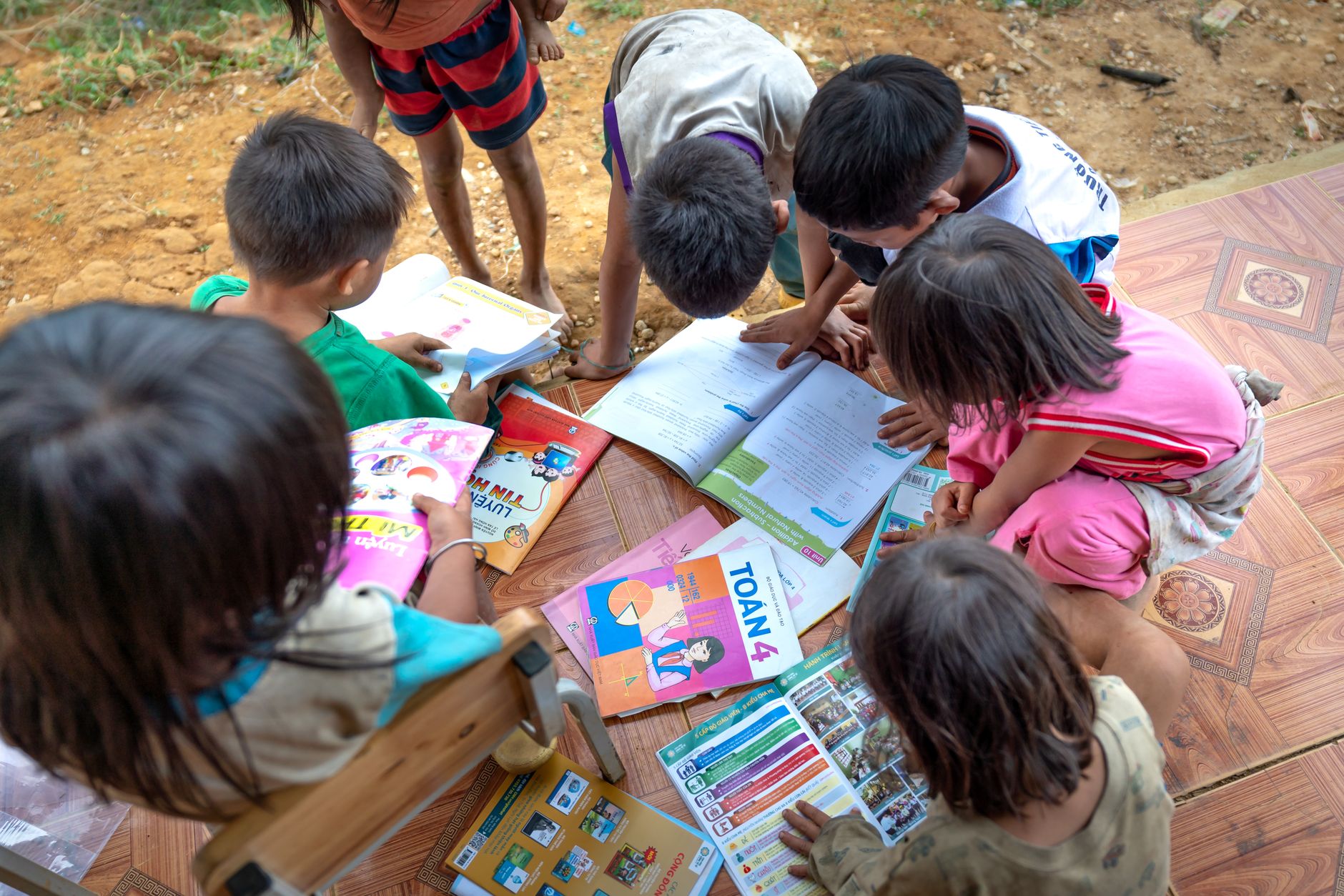 Children studying in overcrowded conditions