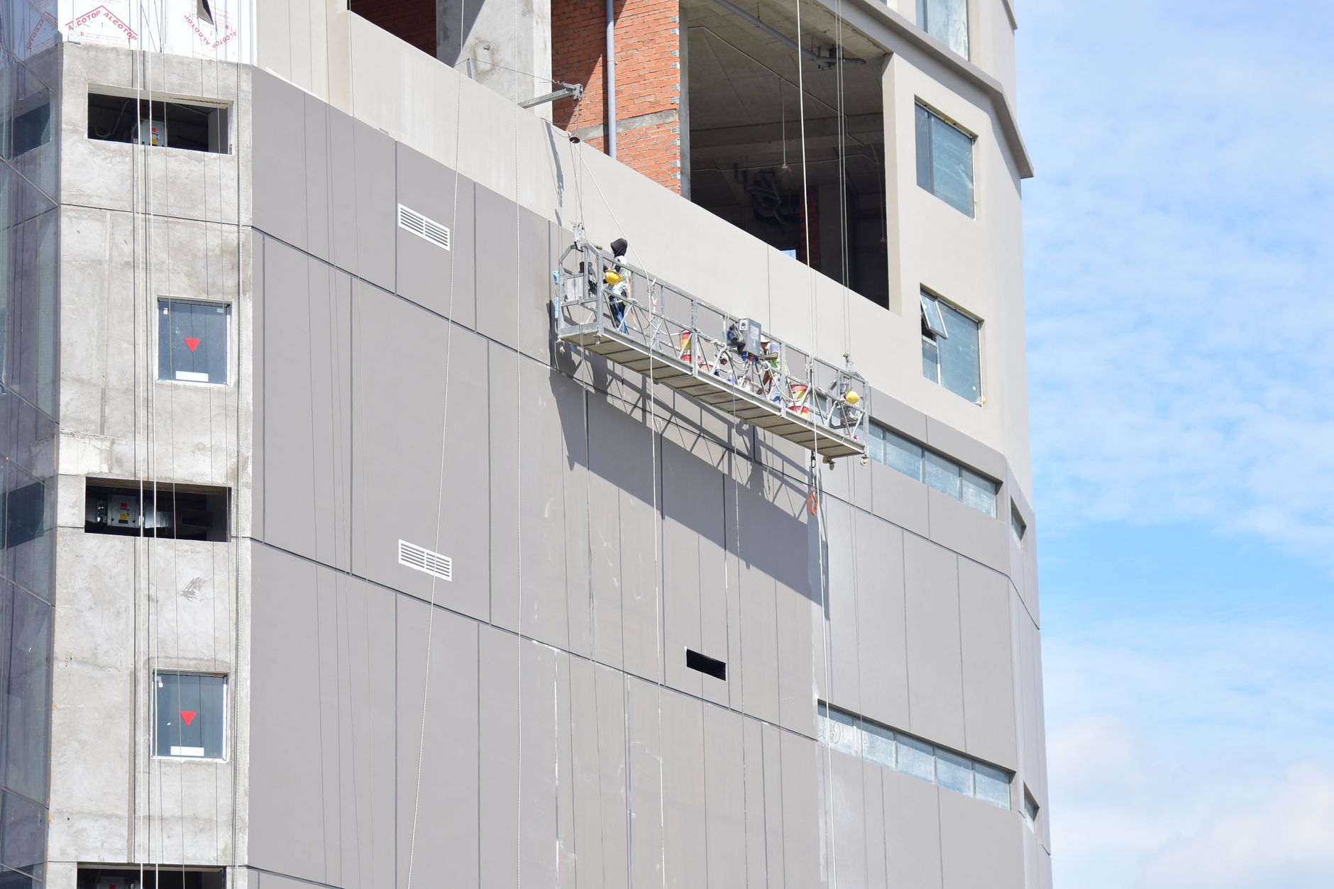 High-rise building with cladding issues - showing scaffolding and repair works