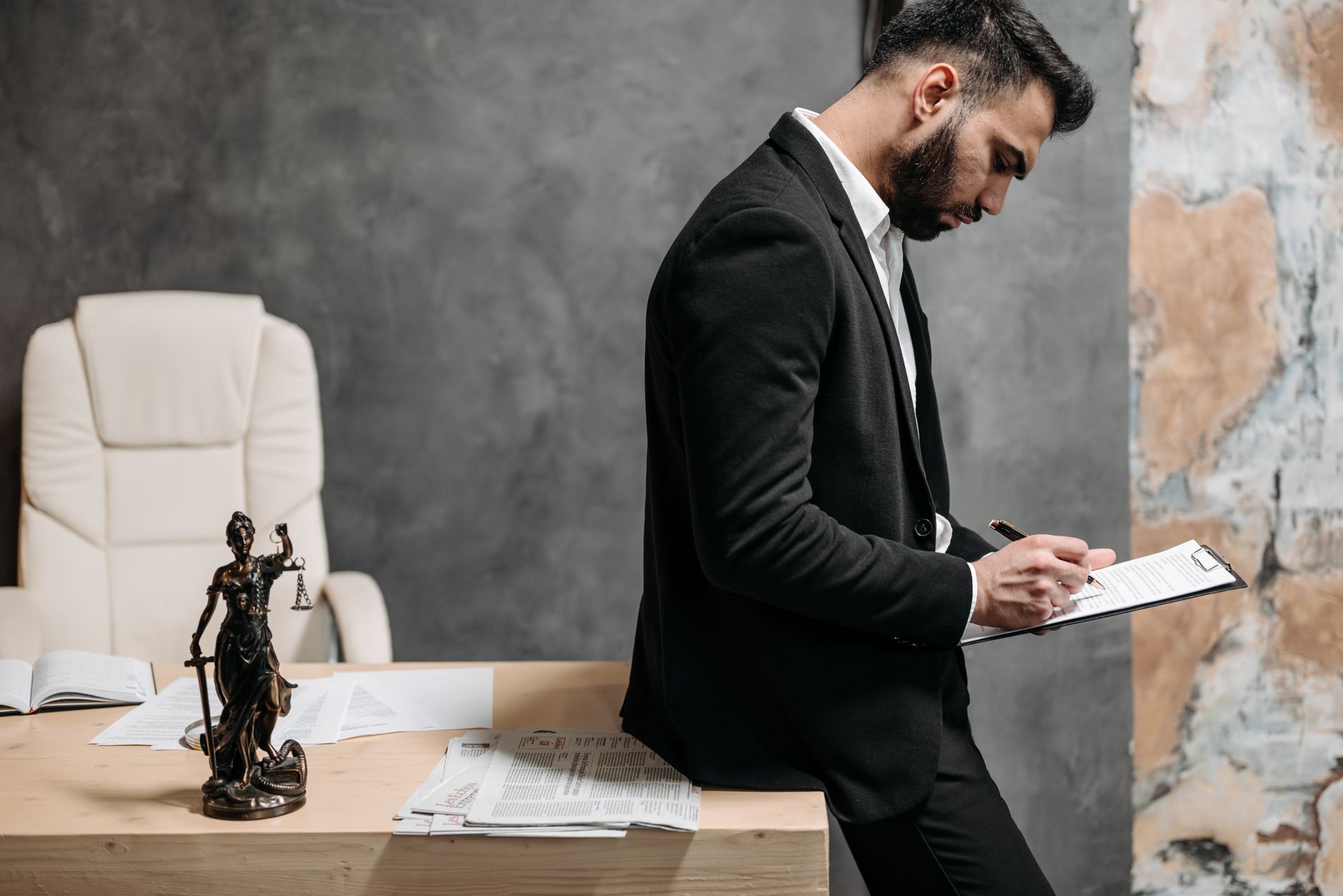 Professional housing officer reviewing tenant case files