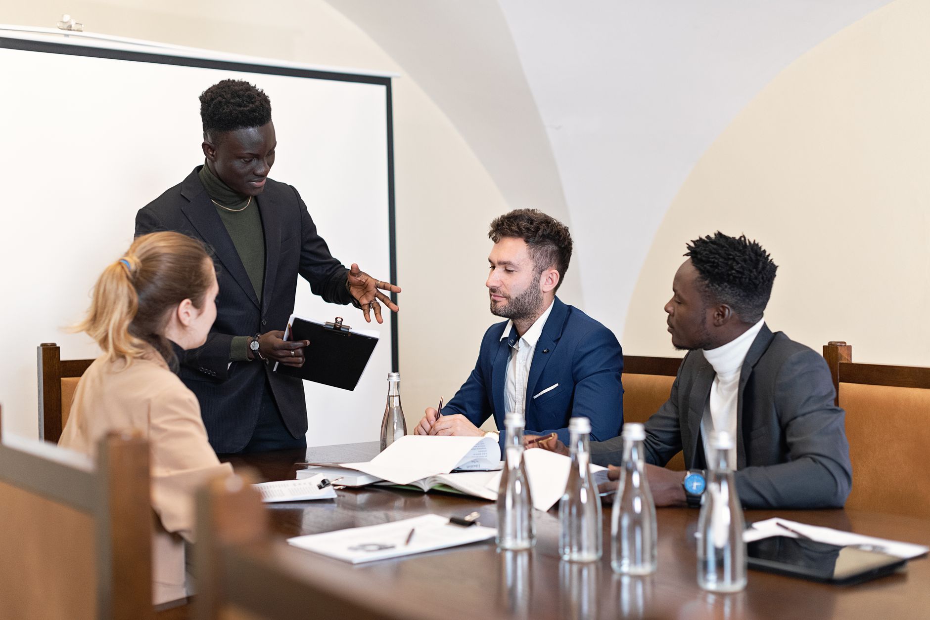 Housing association team meeting - showing professionals discussing strategy