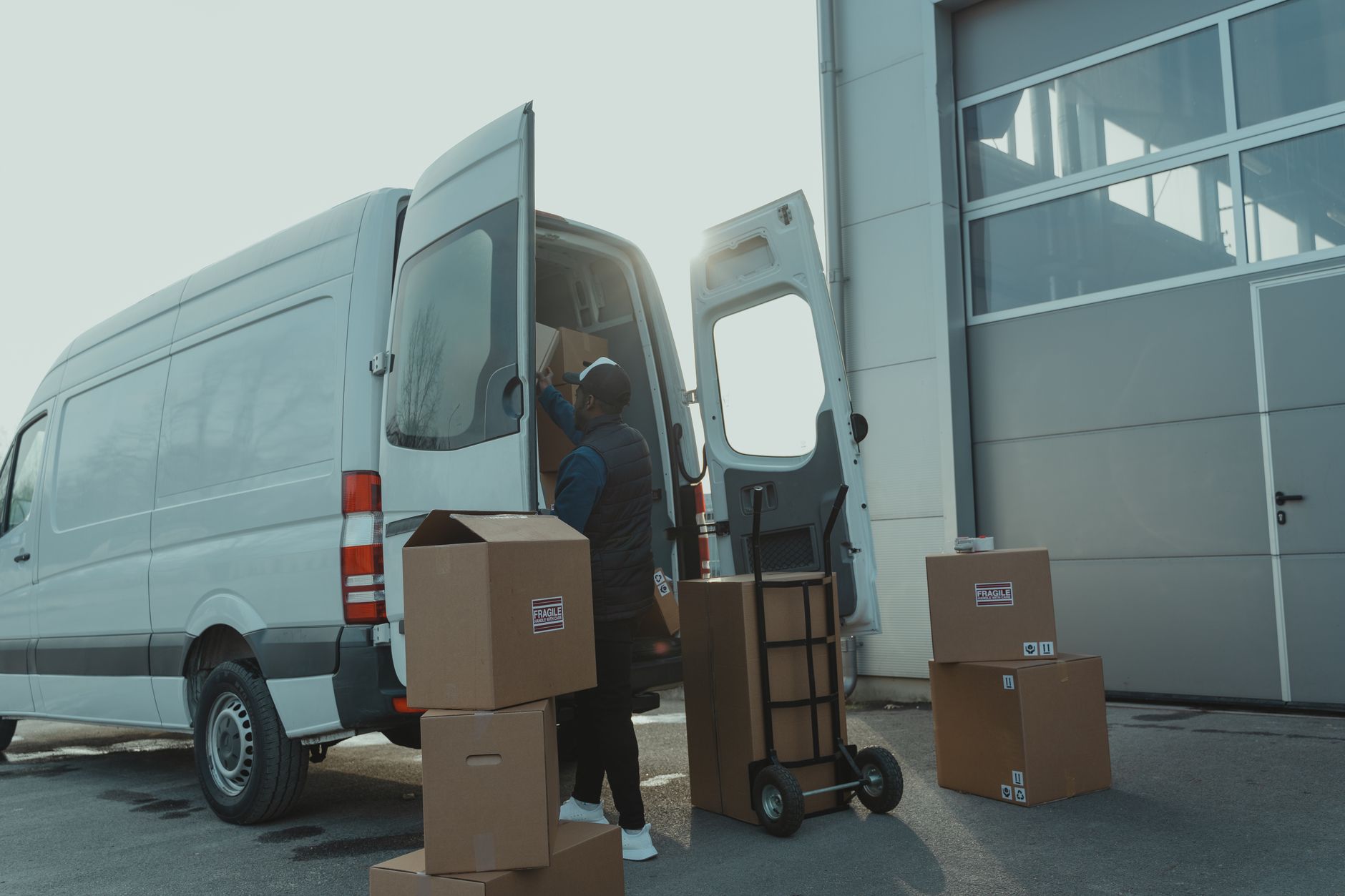 Moving boxes being loaded into a van