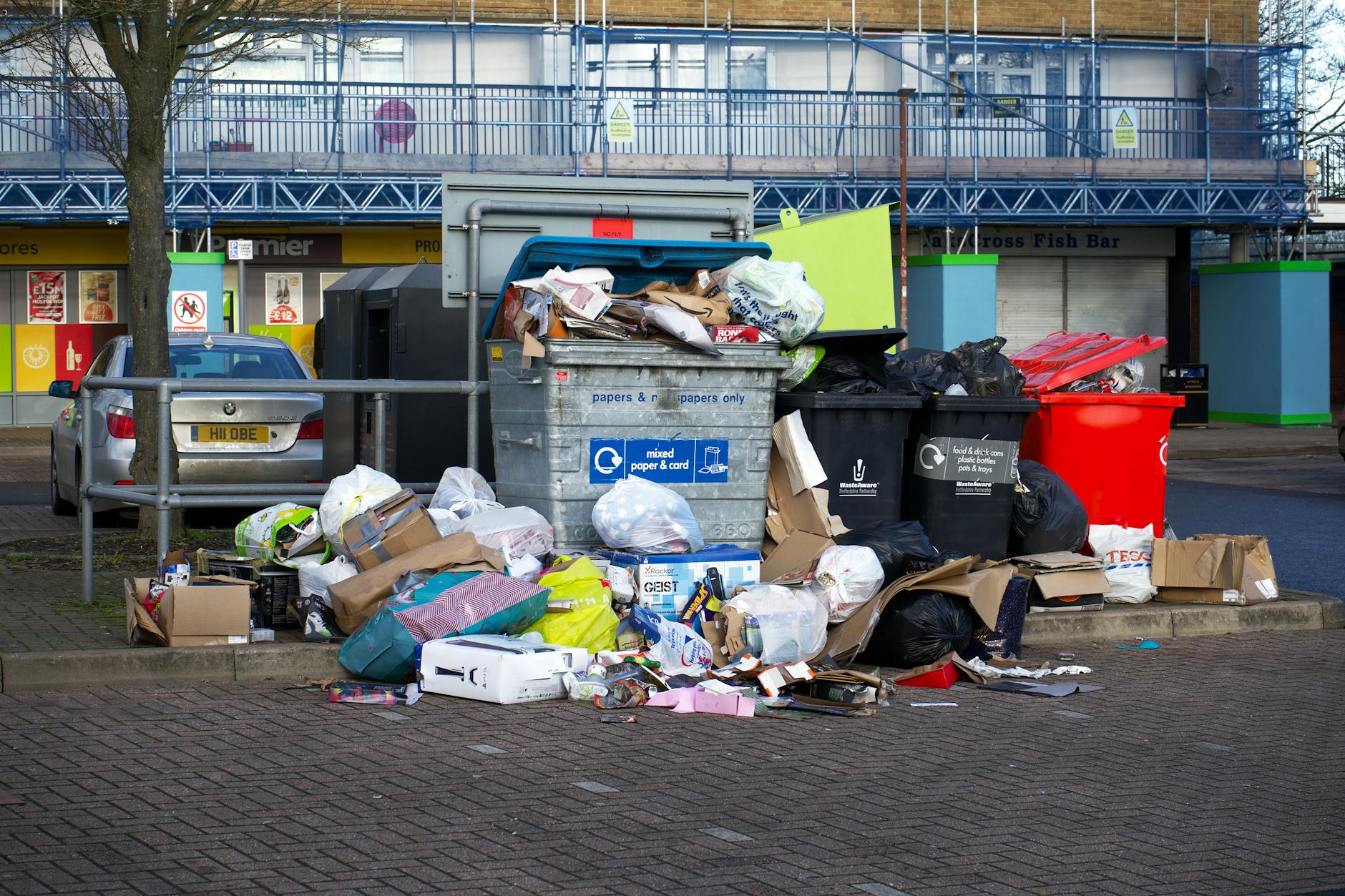 Overflowing wheelie bins outside an HMO property
