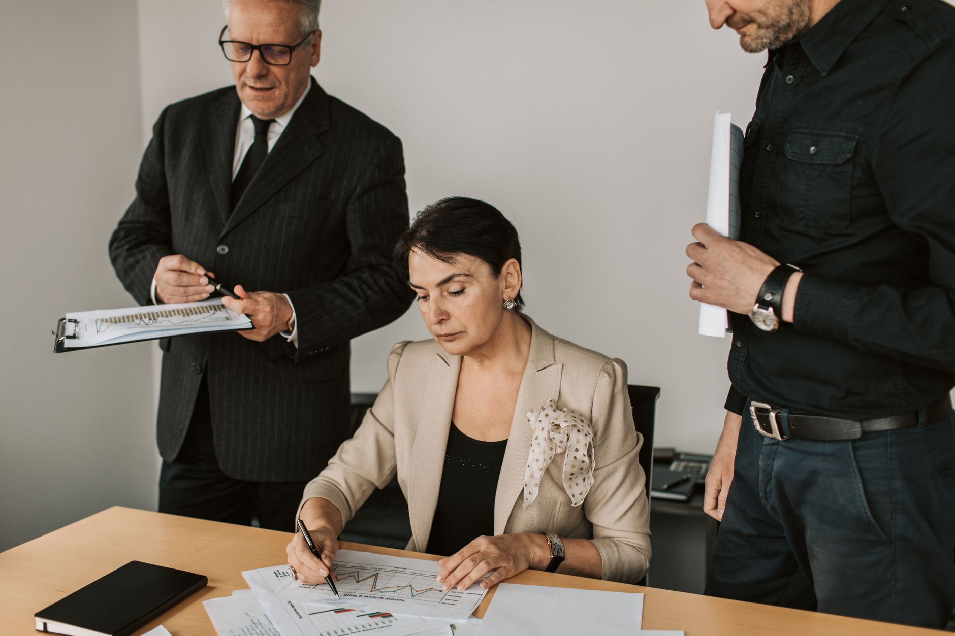 Team of housing professionals reviewing financial documents together