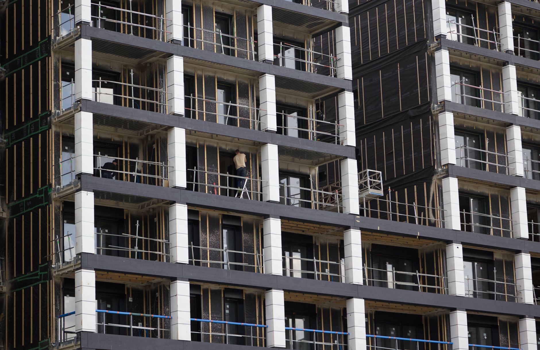 Social housing development under construction with workers onsite