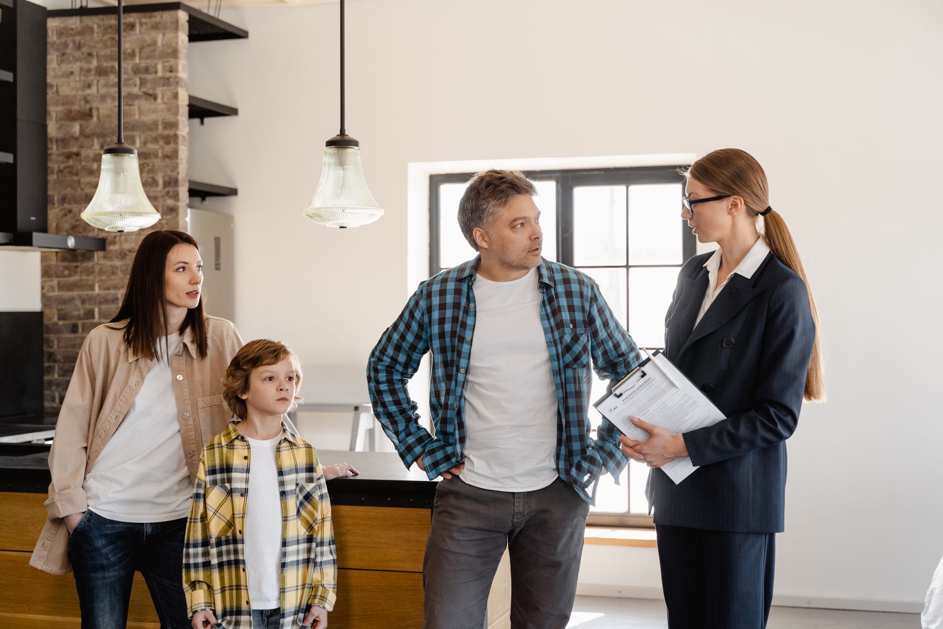 Family in temporary accommodation looking at housing application forms