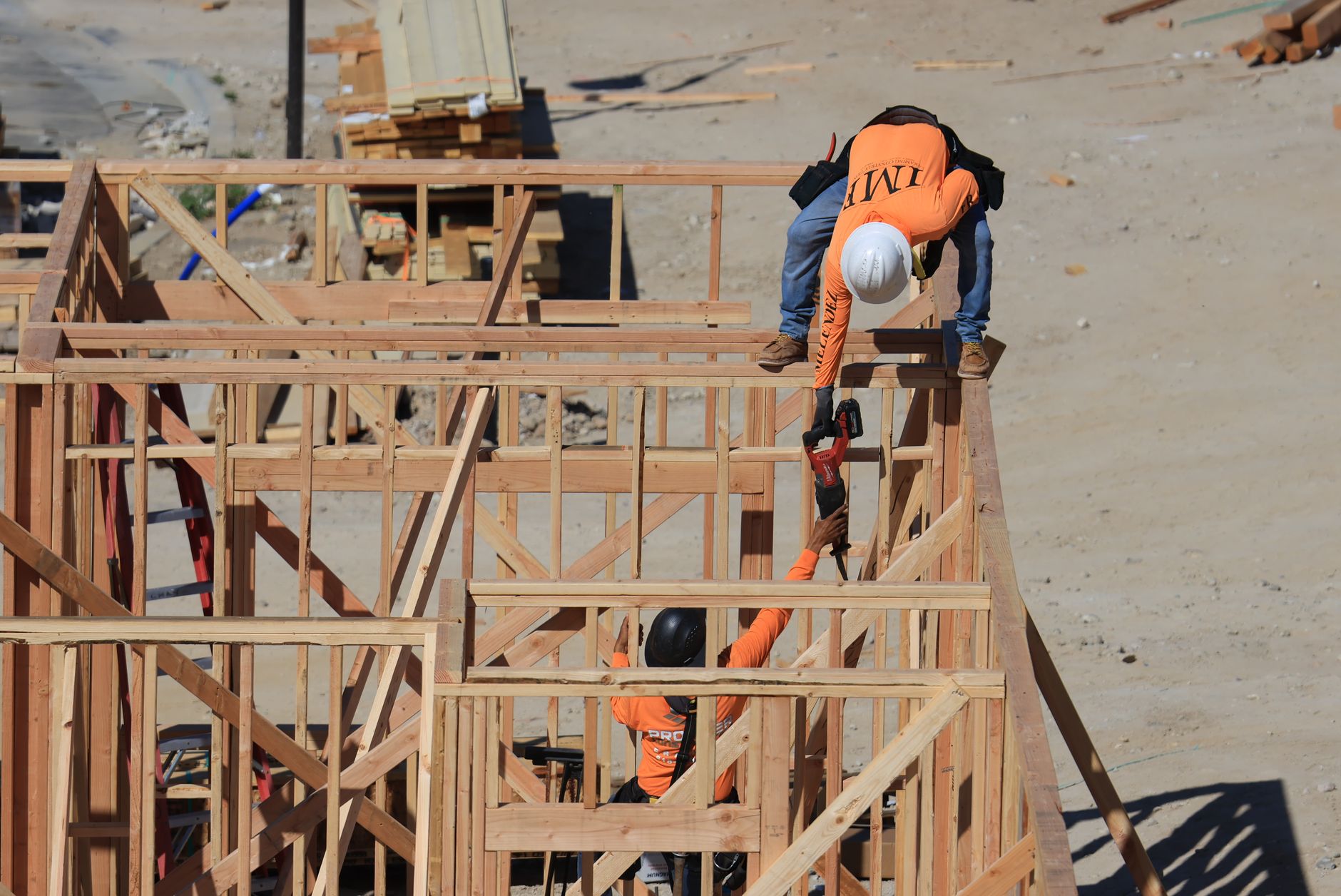 Young apprentices working on a housing development site
