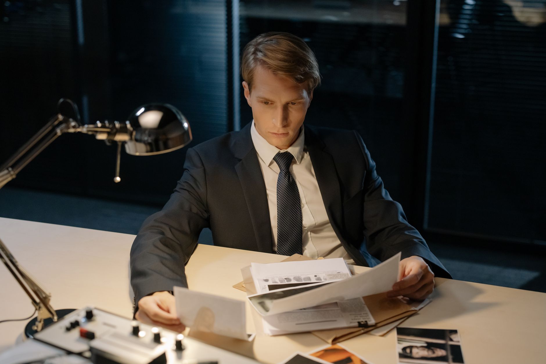 HMRC tax investigation officer reviewing documents