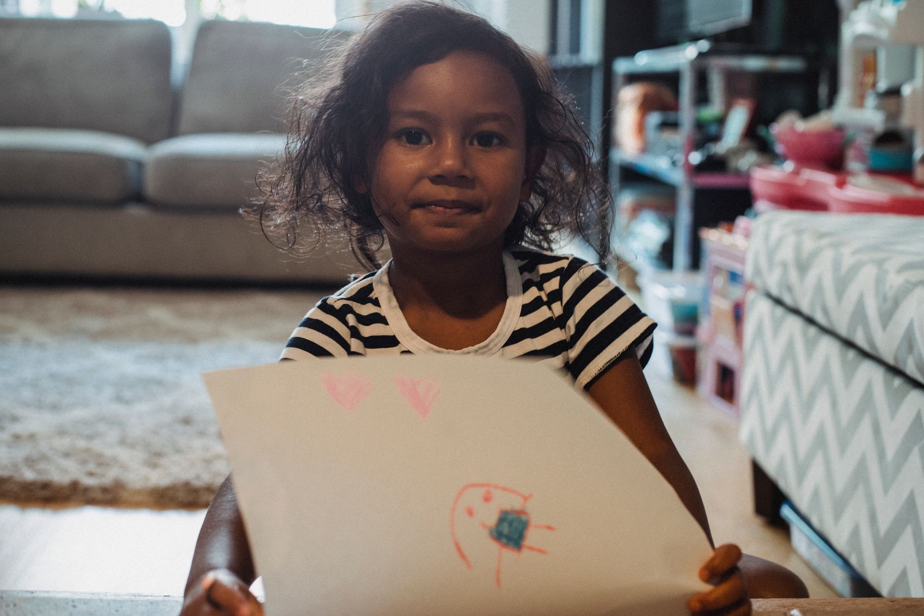 Child's drawing of a mouldy home with sad face - representing Awaab's story