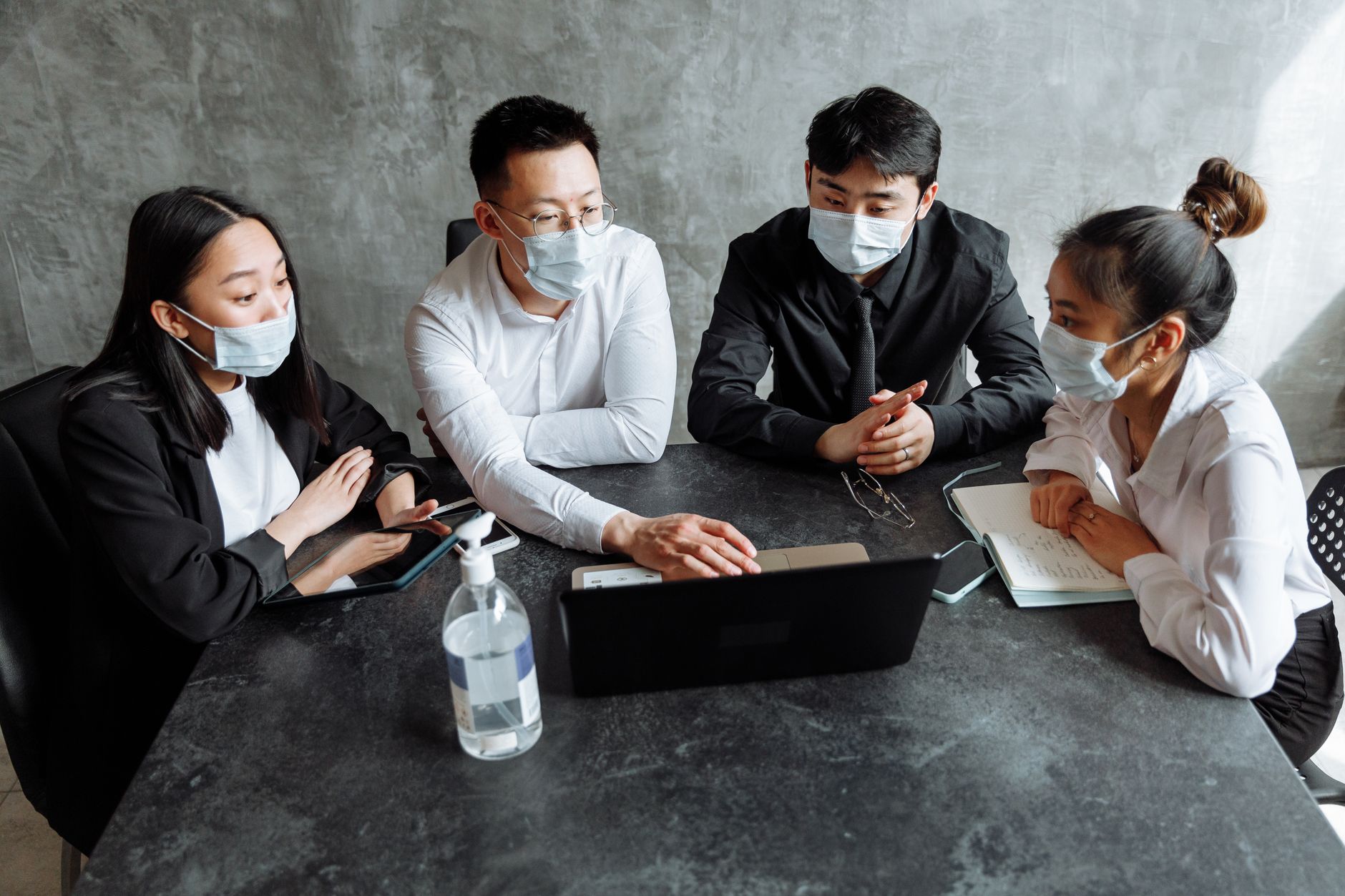 Housing association staff meeting discussing emergency protocols