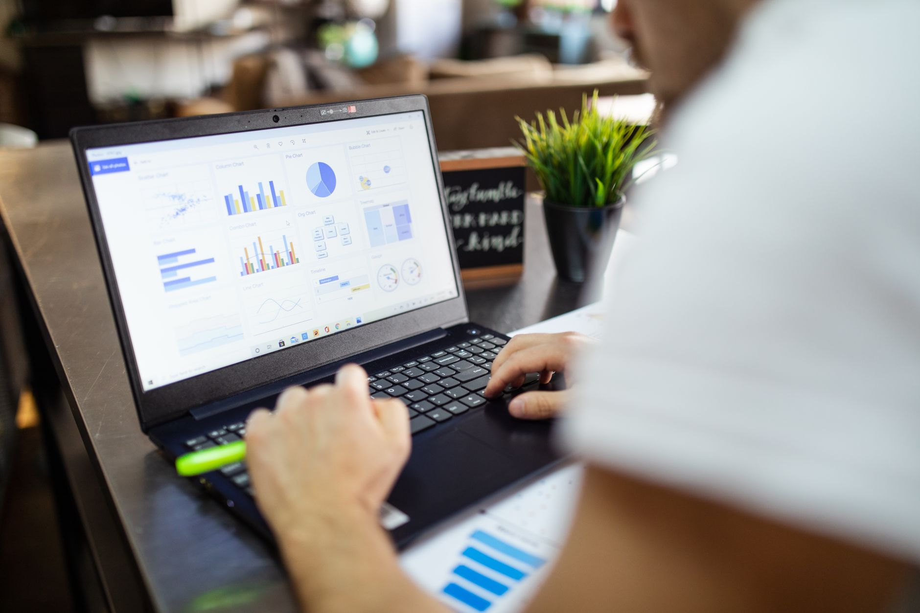 Financial charts and housing data analysis on computer screen
