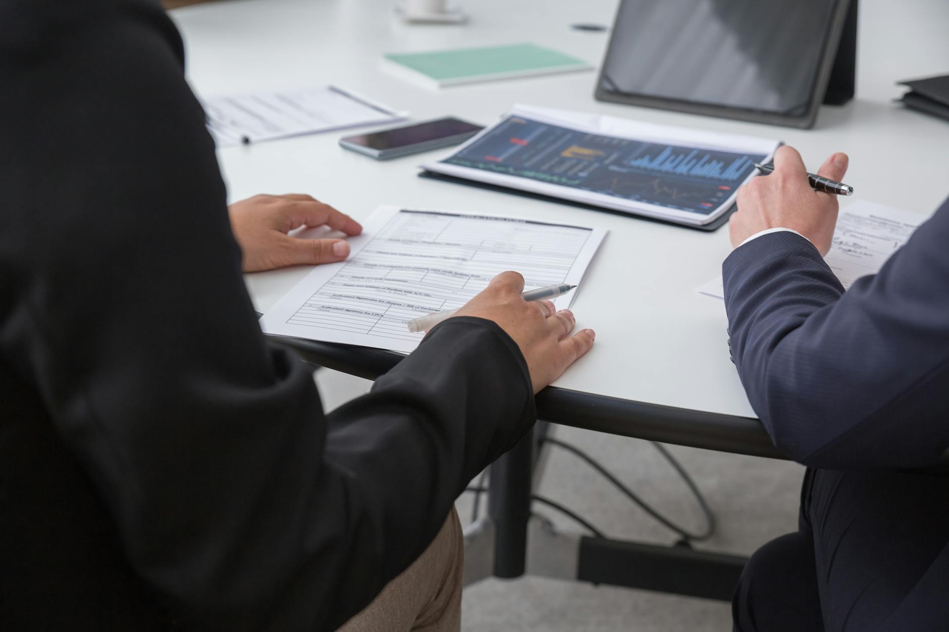 Professional team reviewing housing data in office setting