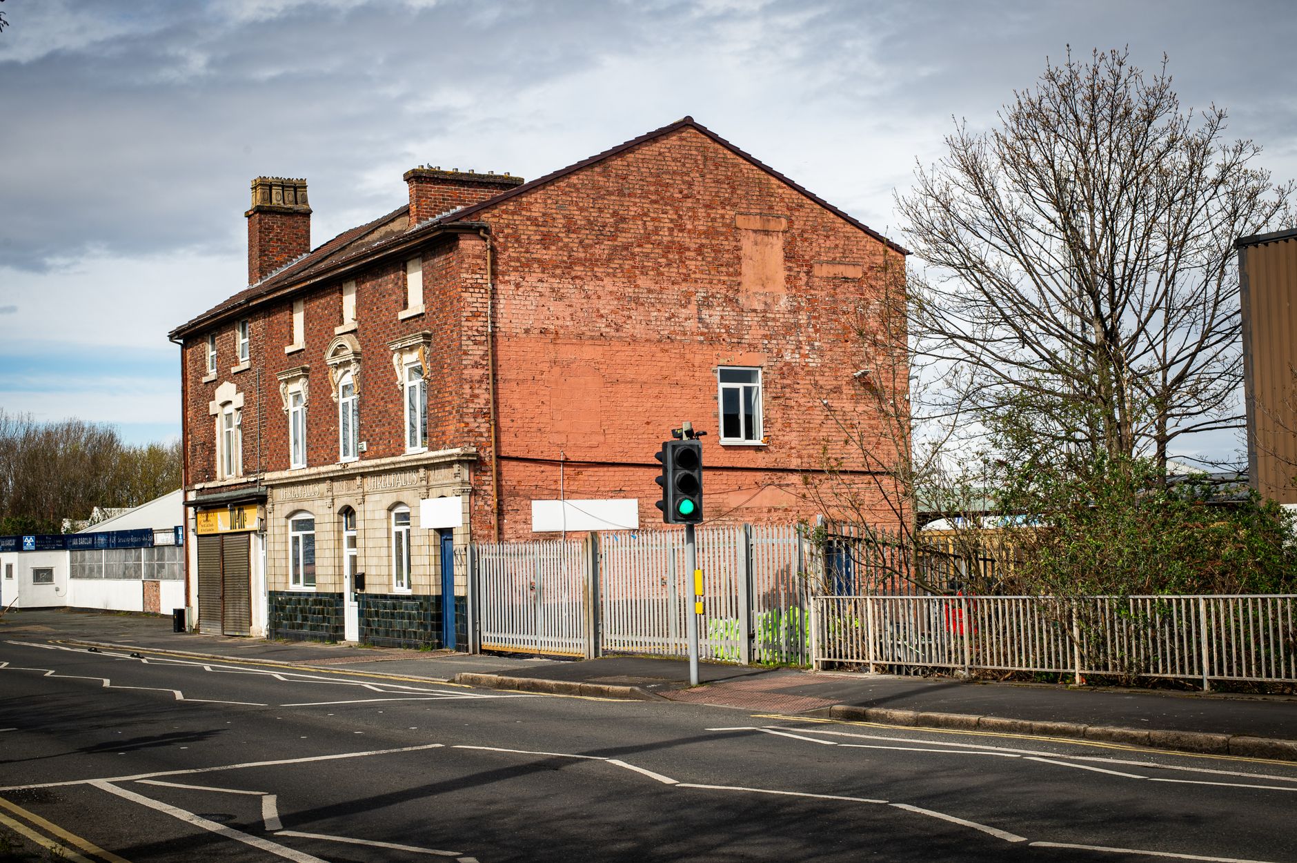Exterior view of a poorly maintained HMO property in Liverpool