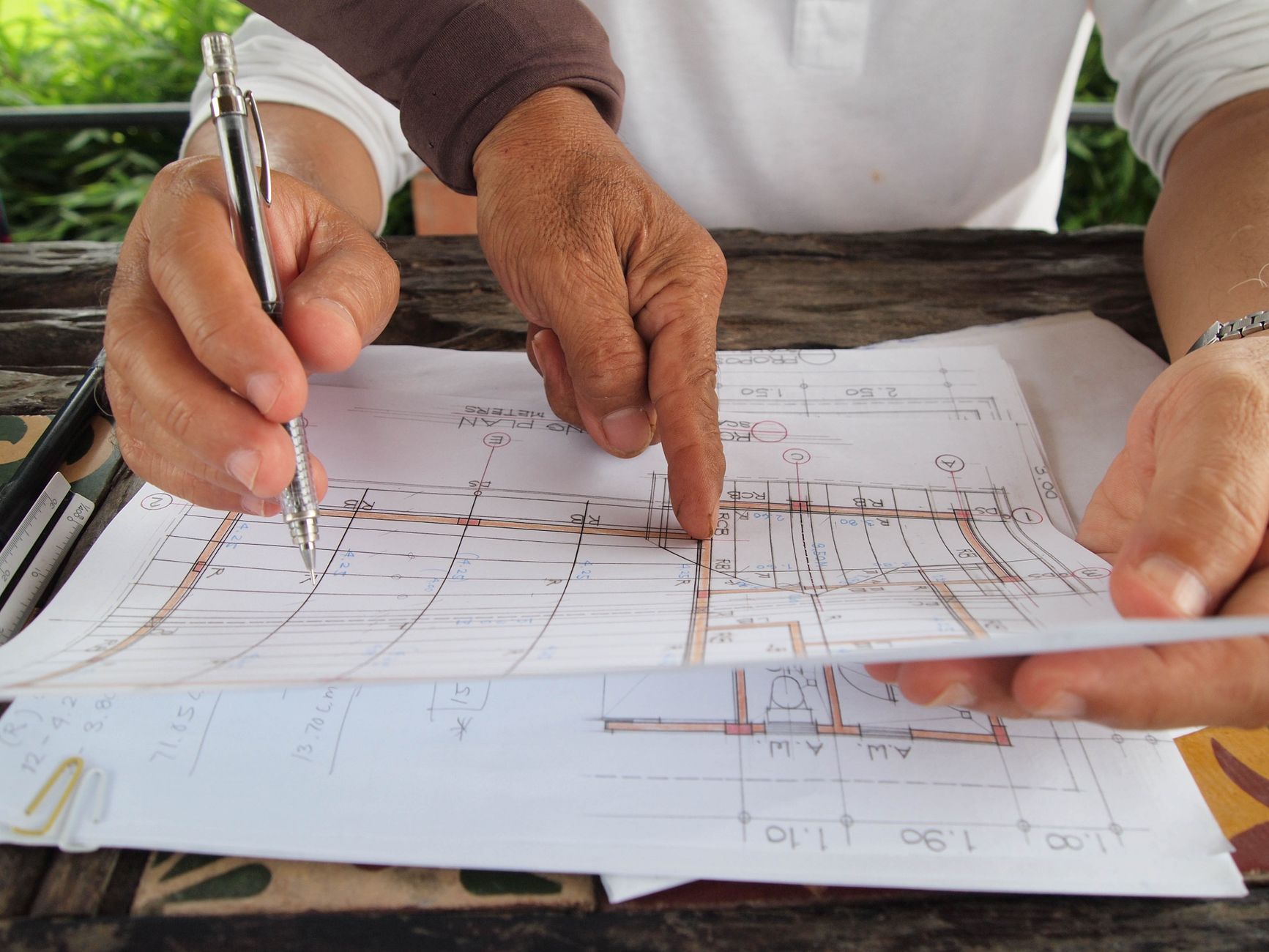 Architect reviewing building plans for thermal efficiency