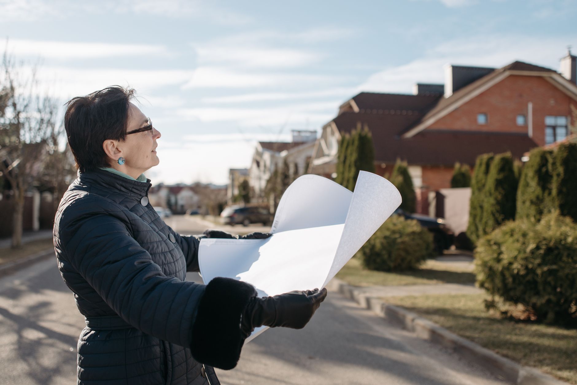 Architect reviewing plans for mixed-tenure housing development