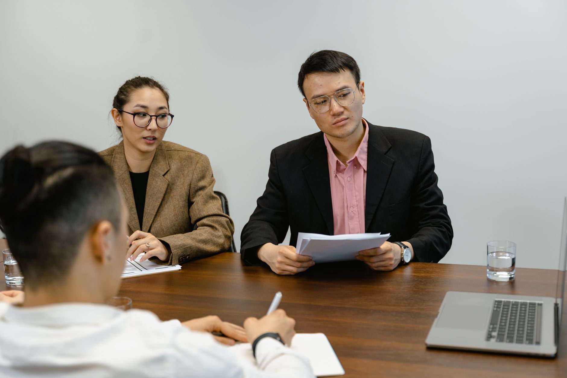 Planning meeting with council members discussing documents