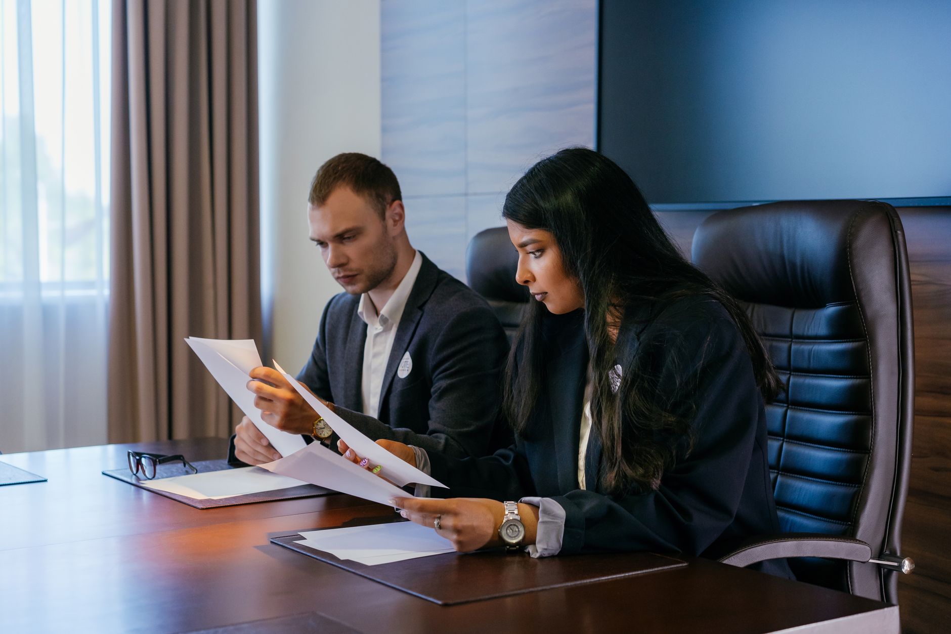 Housing association team reviewing compliance documents