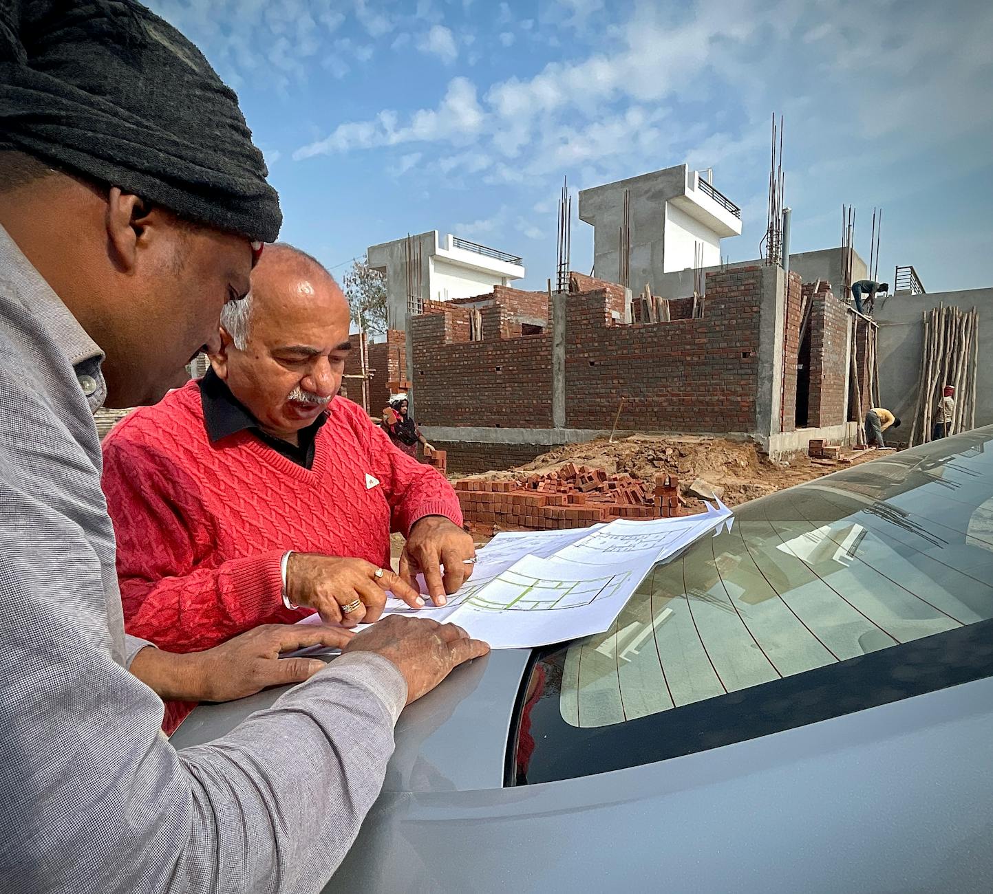 Architect reviewing housing development plans with community members