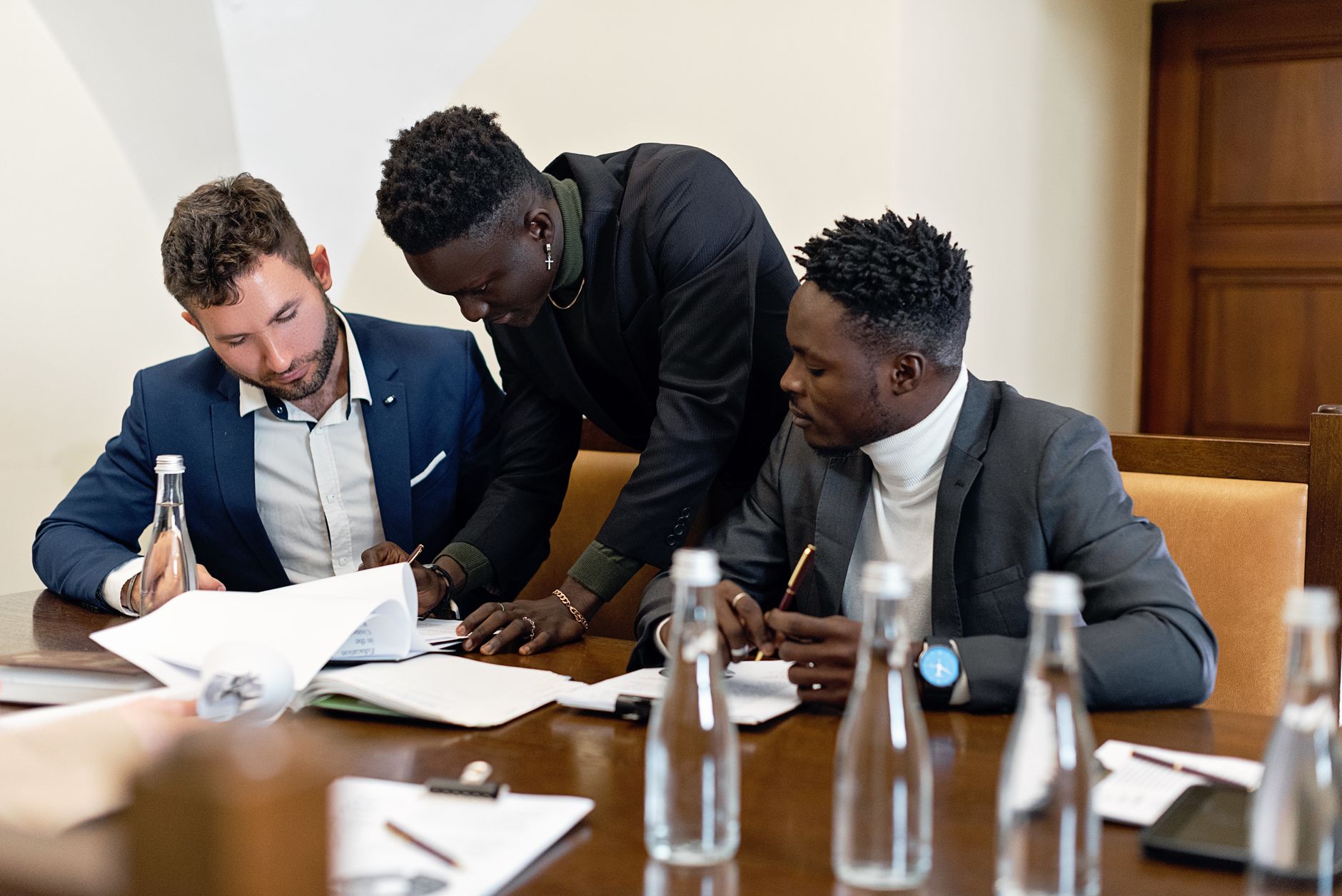 Housing association staff reviewing property financing documents