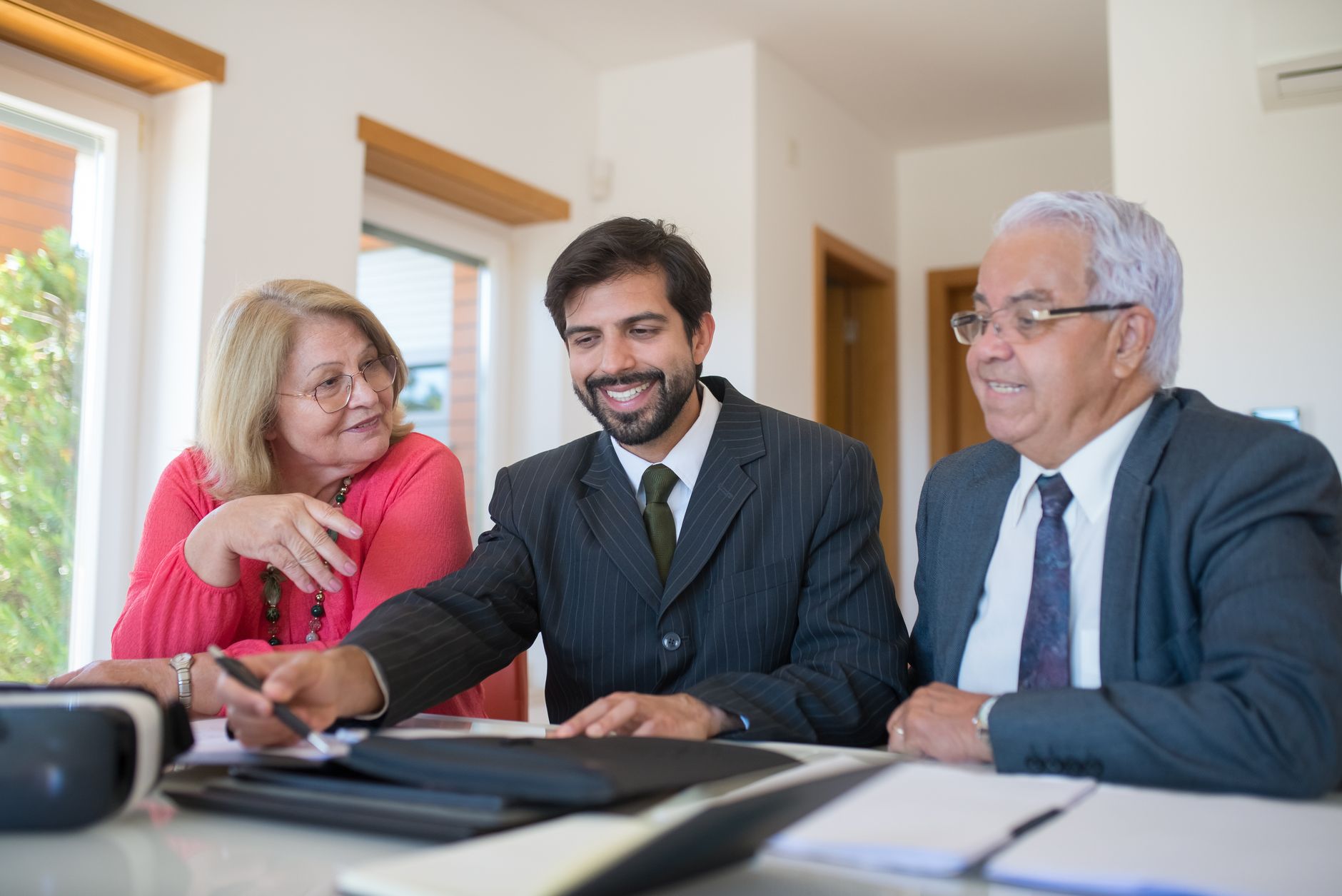 Professional housing officer assisting elderly tenant - showing quality social housing support