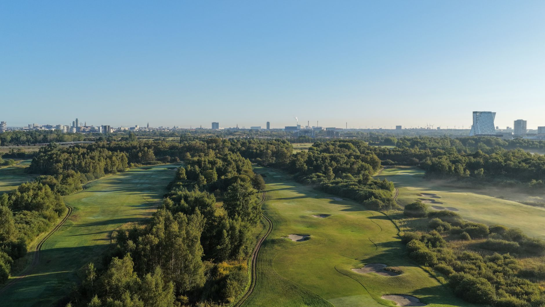 Aerial view of Gatley Golf Course development site showing green space and urban surroundings