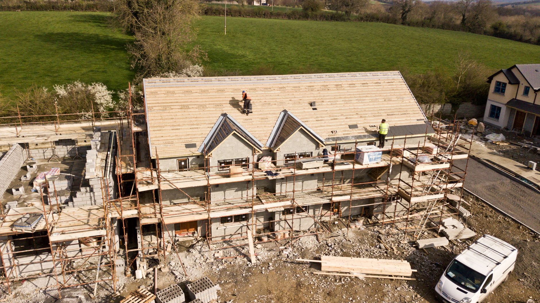 Social housing development in Northern Ireland showing construction workers on site