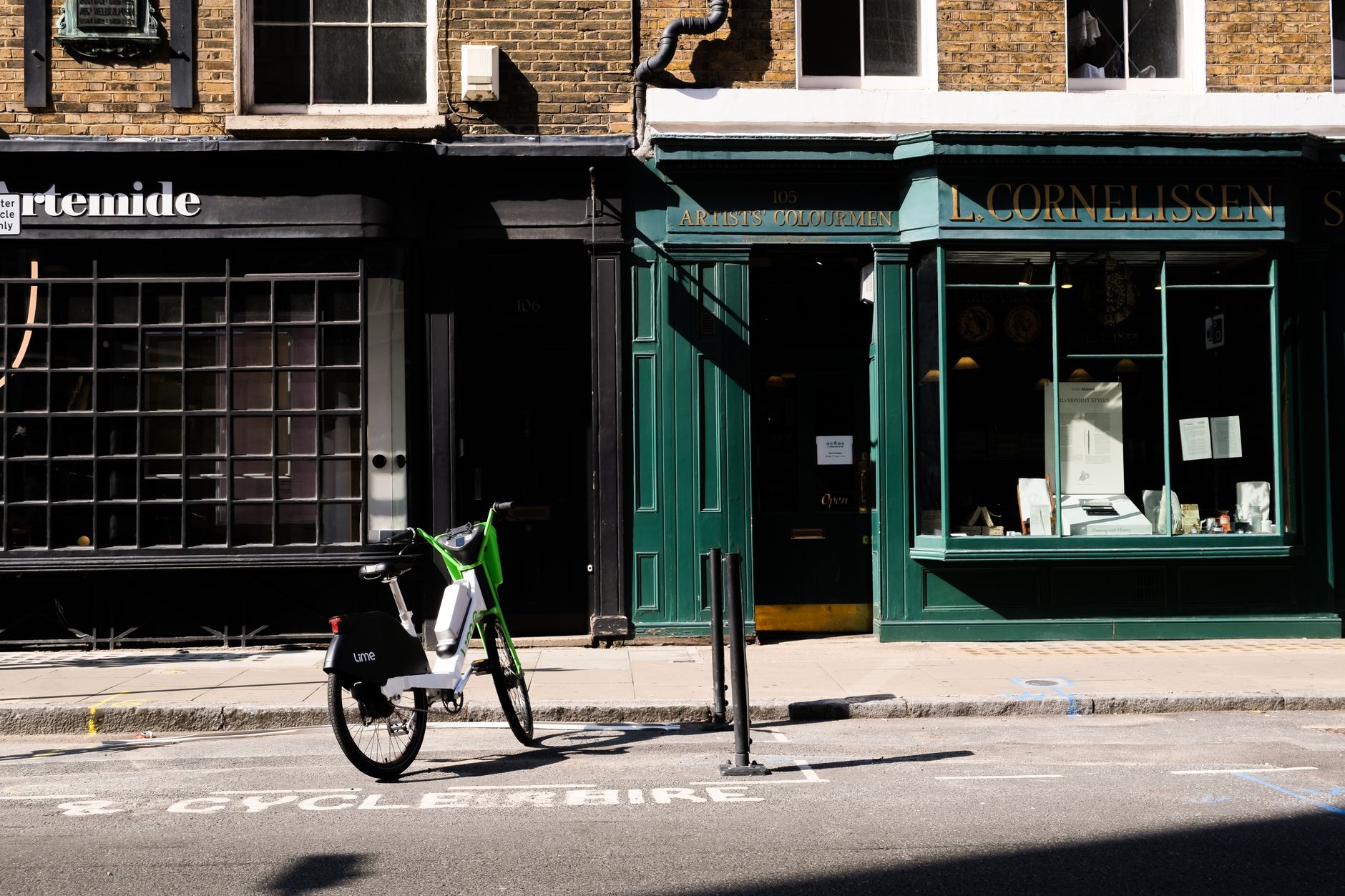 Historic Brick Lane street scene with curry houses and bagel shops