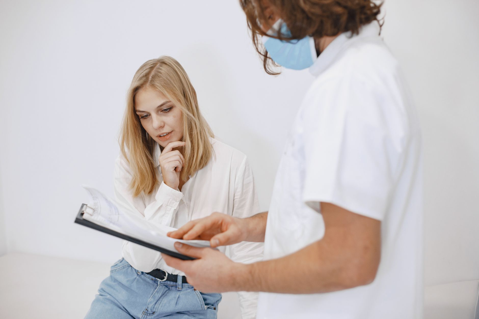 NHS worker discussing housing with a patient